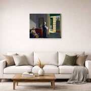 Unframed poster print of Edward Hopper's 'Hotel by a Railroad' displayed on a wall in a living room (image 2 of 2)