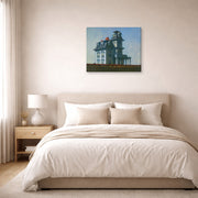 Gallery-wrapped canvas print of Edward Hopper's 'The House by the Railroad' displayed on a wall in a bedroom