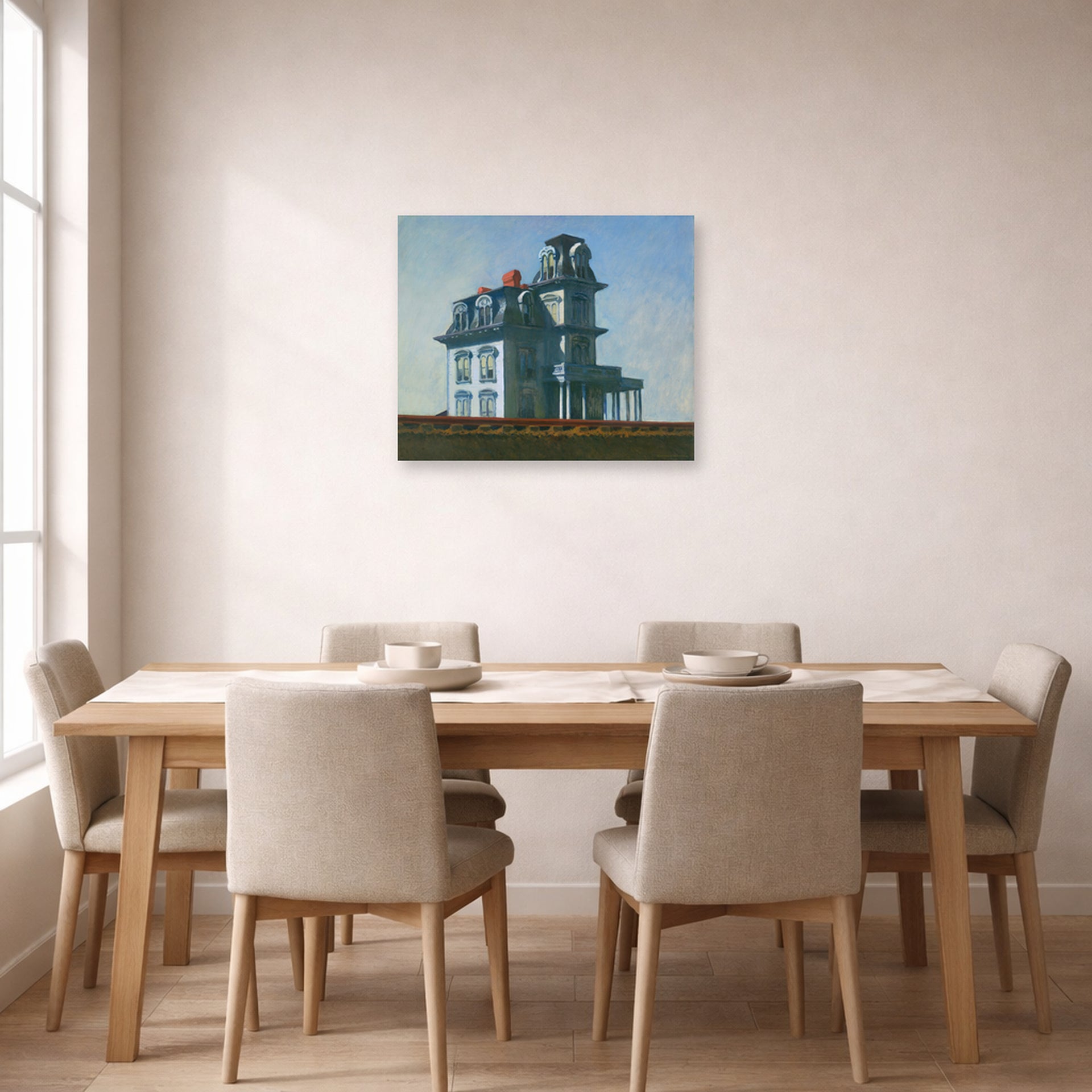 Unframed poster print of Edward Hopper's 'The House by the Railroad' displayed on a wall in a dining room