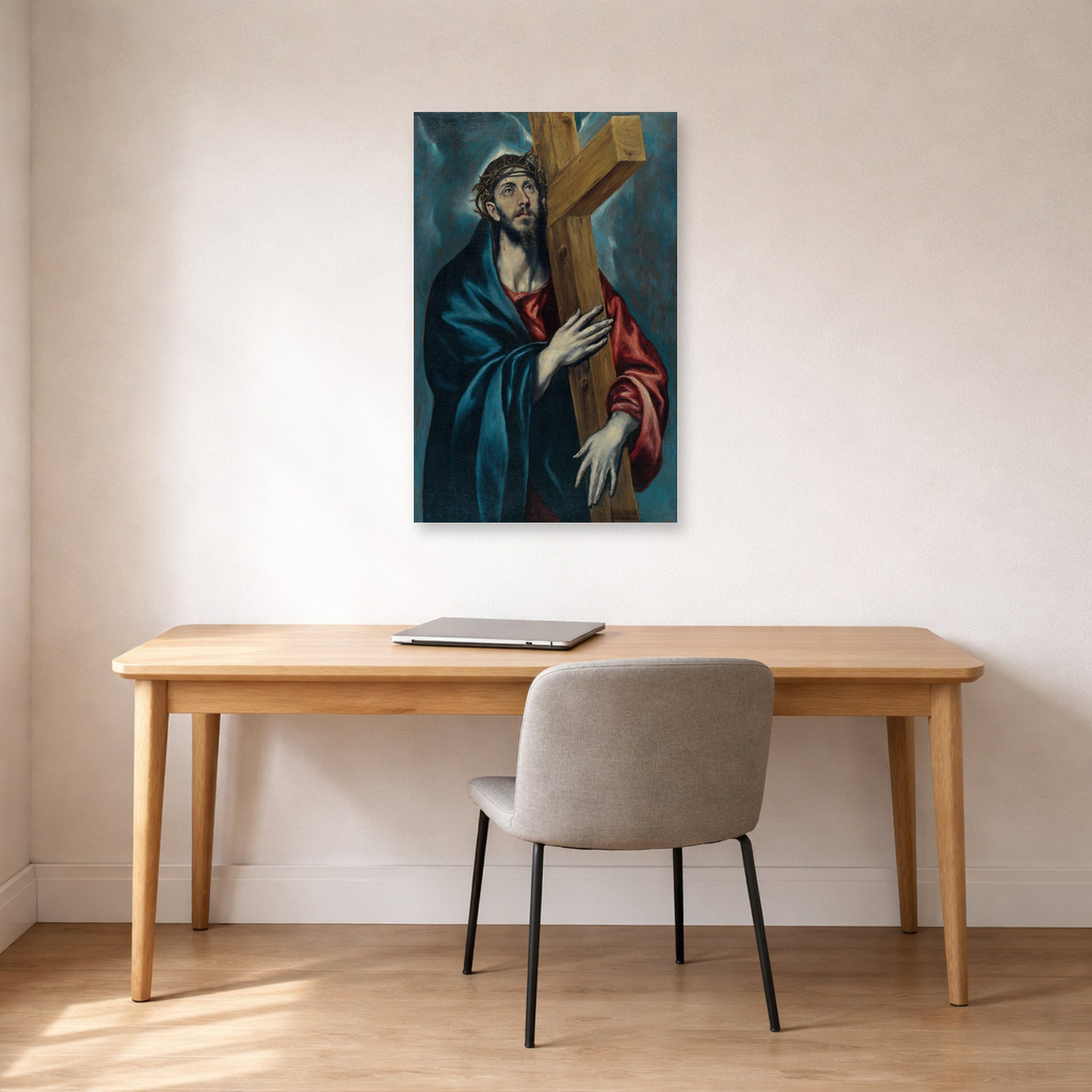 Unframed poster print of El Greco's Christ Carrying The Cross displayed on a wall in an office