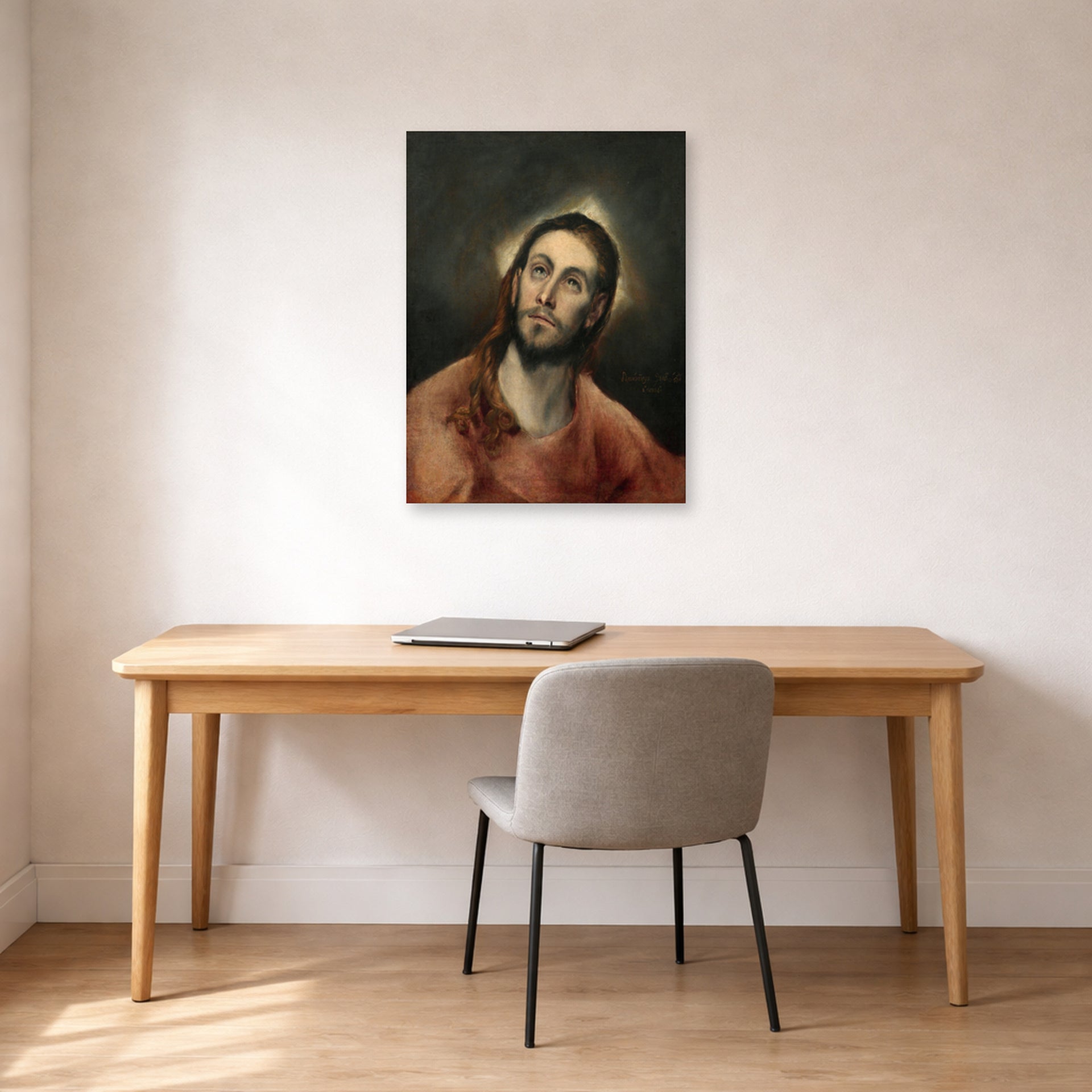Unframed poster print of El Greco's Christ in Prayer displayed on a wall in an office