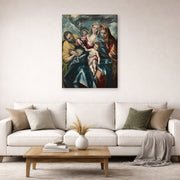 Gallery-wrapped canvas print of El Greco's Holy Family displayed on a wall in a living room