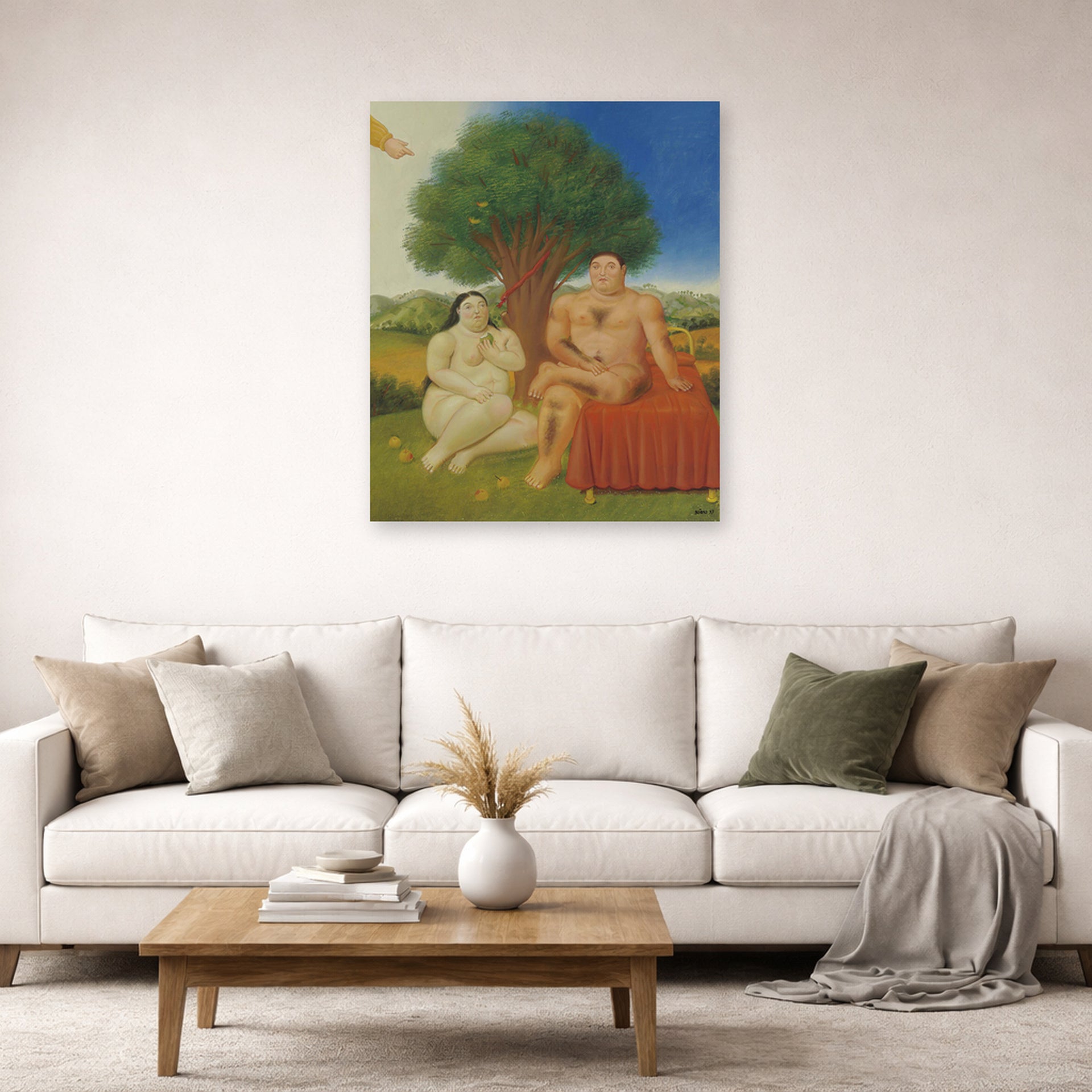 Unframed poster print of Fernando Botero's Adam and Eve displayed on a wall in a living room