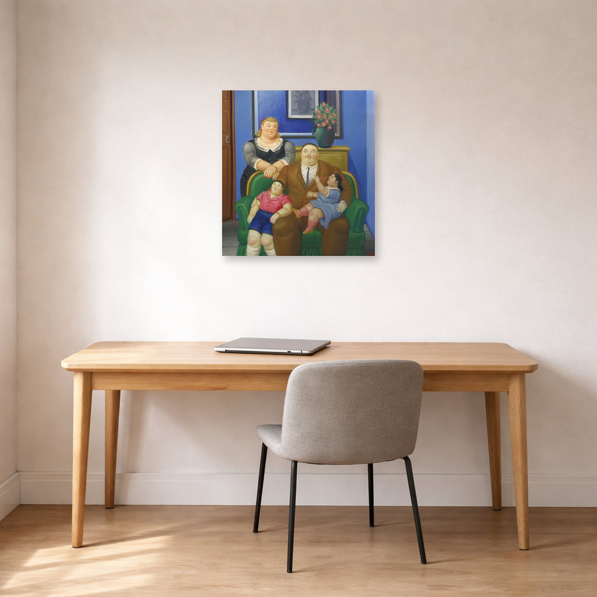 Unframed poster print of Fernando Botero's Family (1995) displayed on a wall in a home office