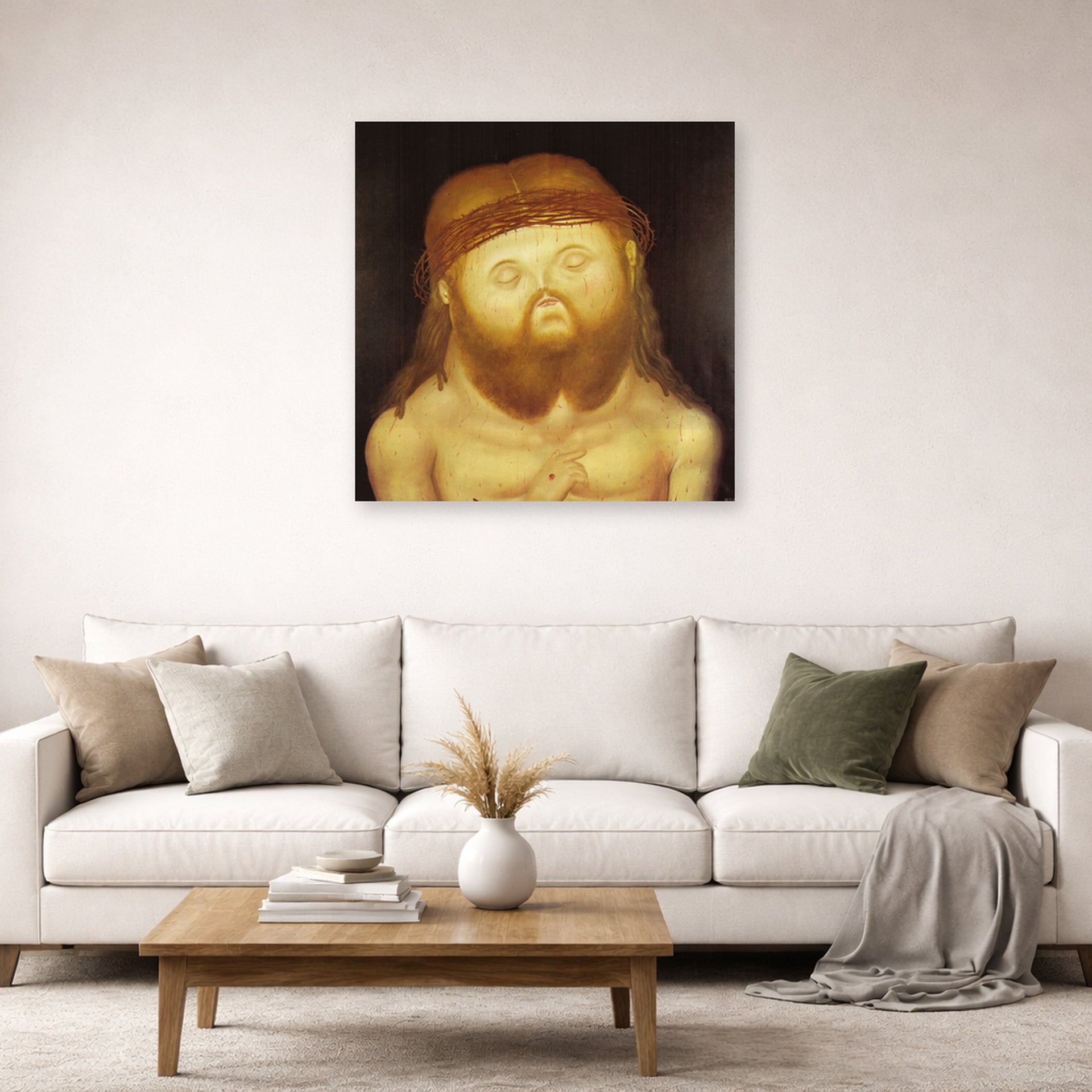 Unframed poster print of Fernando Botero's Head of Christ displayed on a wall in a living room