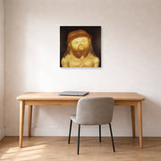 Unframed poster print of Fernando Botero's Head of Christ displayed on a wall in a home office