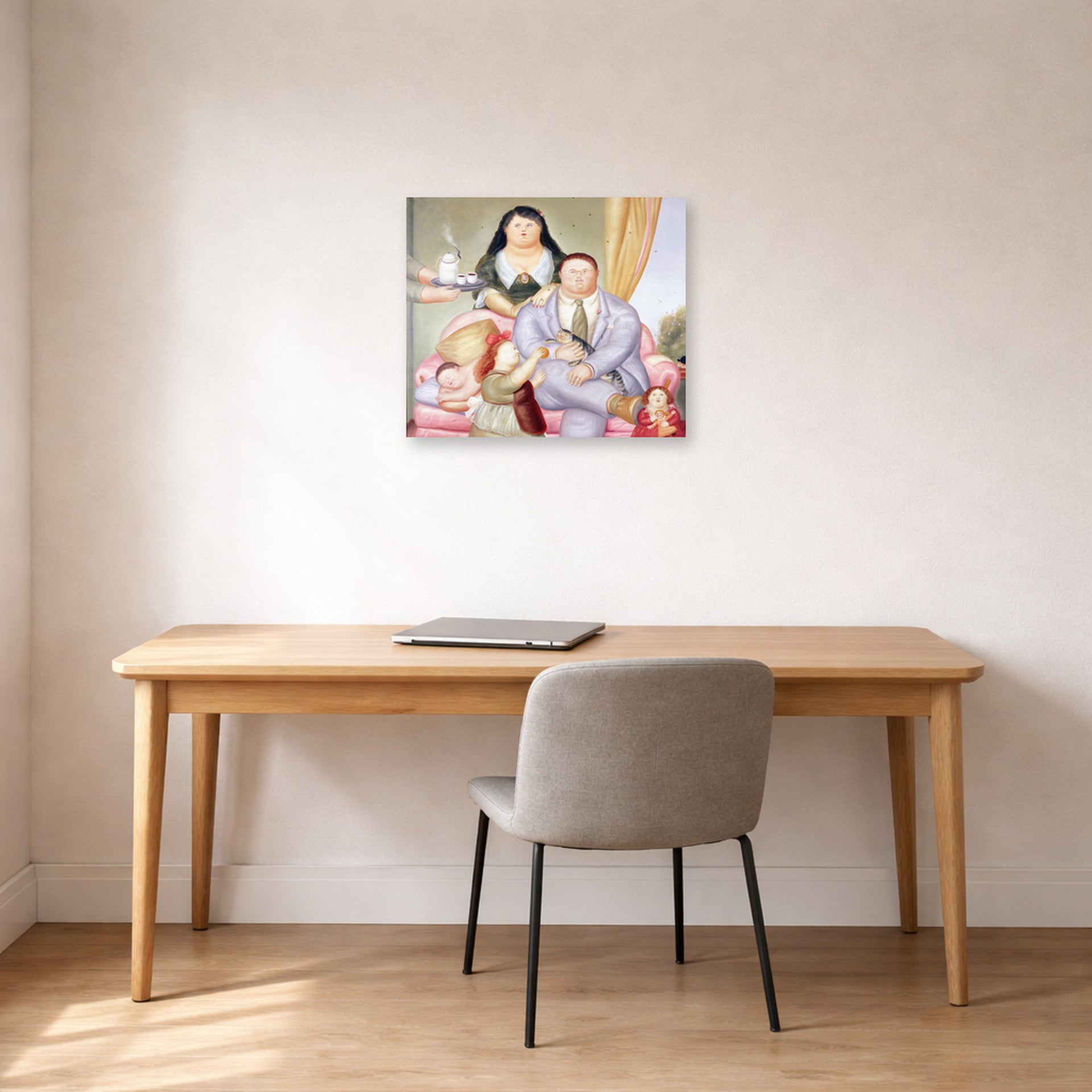 Unframed poster print of Fernando Botero's La Familia Colombiana displayed on a wall in a home office