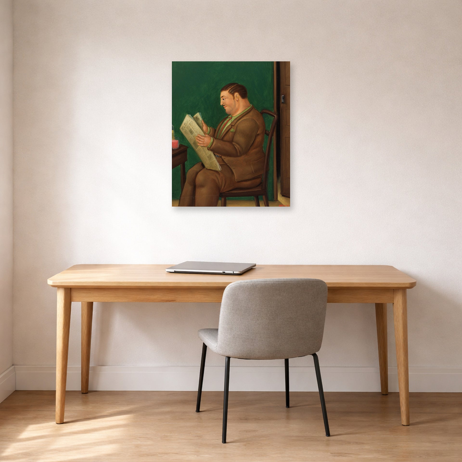 Unframed poster print of Fernando Botero's Man with Newspaper displayed on a wall in a home office