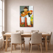Gallery-wrapped canvas print of Fernando Botero's Man with a Guitar displayed on a wall in a dining room