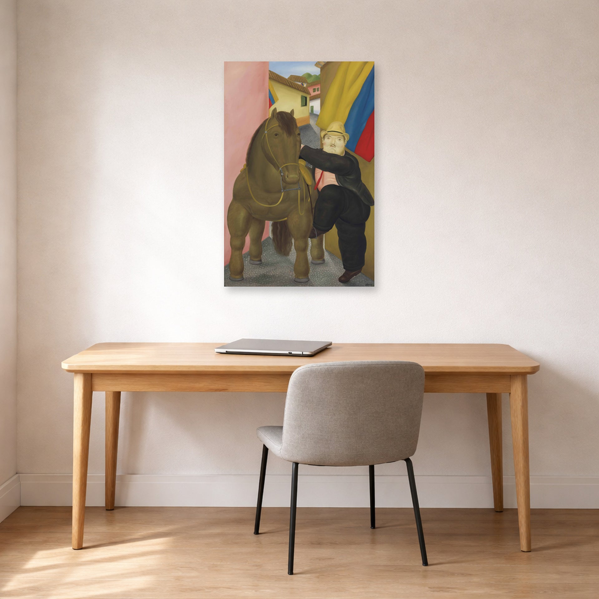 Unframed poster print of Fernando Botero's Man and Horse displayed on a wall in a home office
