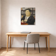 Unframed poster print of Fernando Botero's Mario Vargas Llosa displayed on a wall in a home office