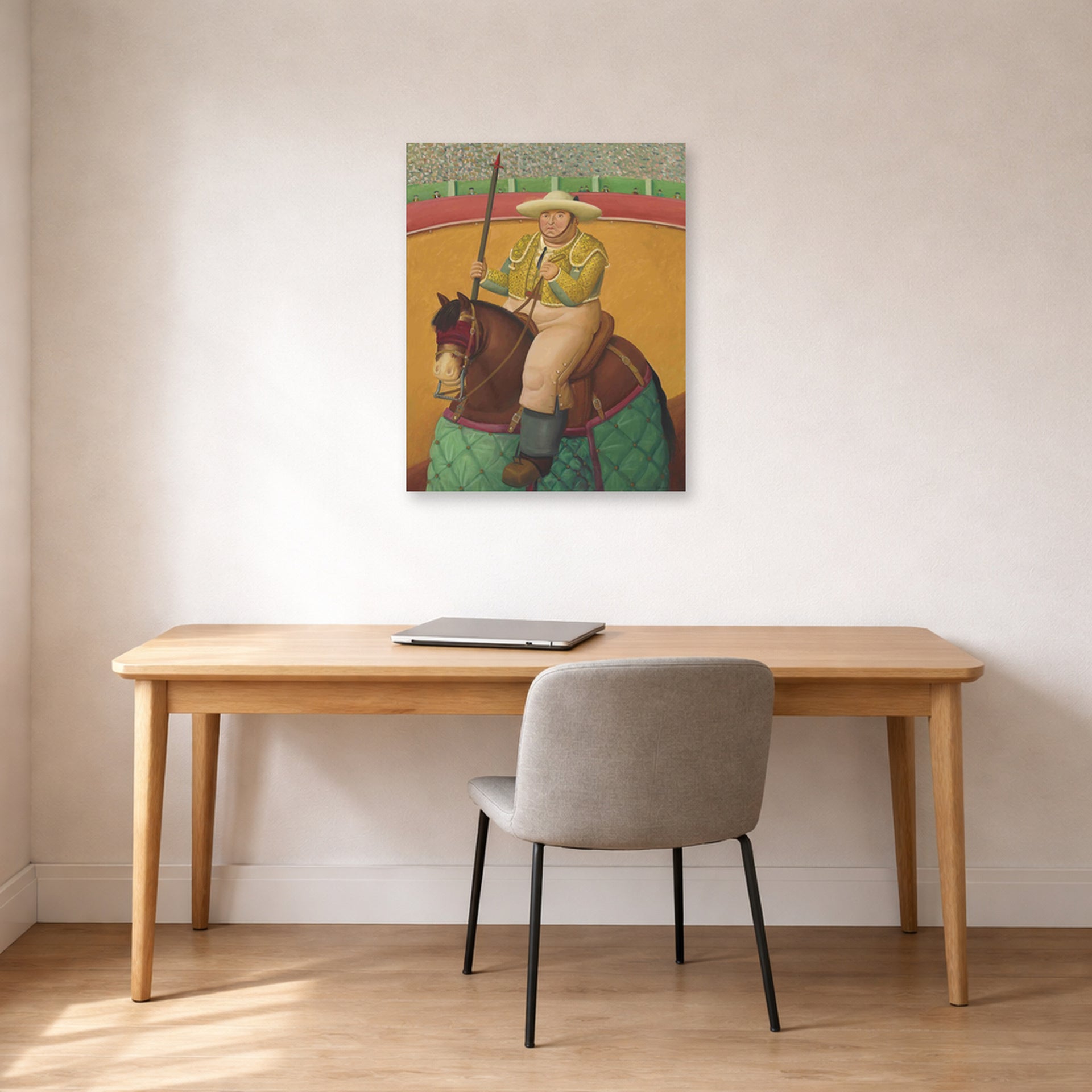 Unframed poster print of Fernando Botero's Picador displayed on a wall in a home office