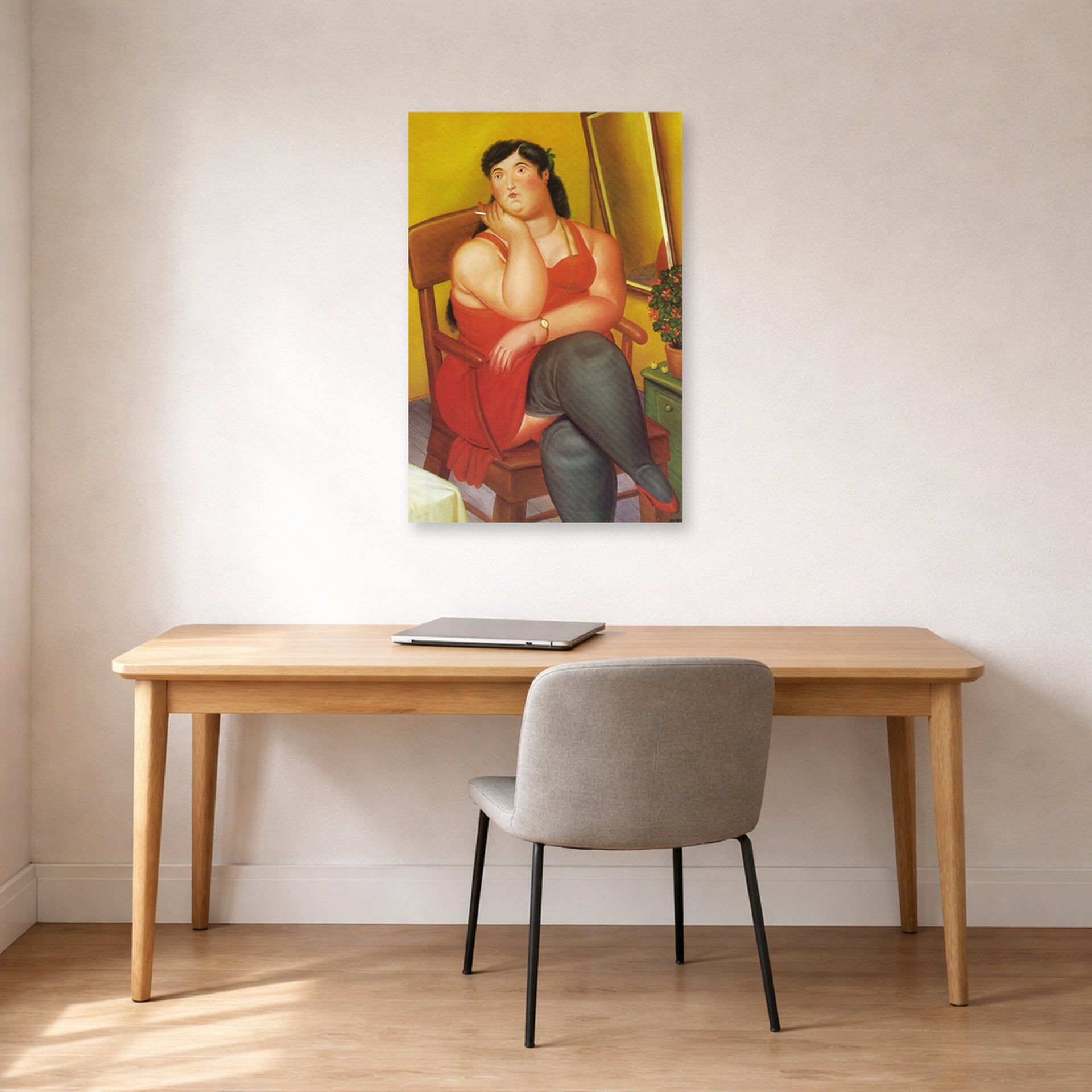 Unframed poster print of Fernando Botero's The Colombian Based displayed on a wall in a home office