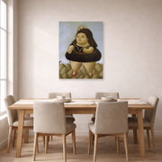 Unframed poster print of Fernando Botero's Tour of the Volcano displayed on a wall in a dining room