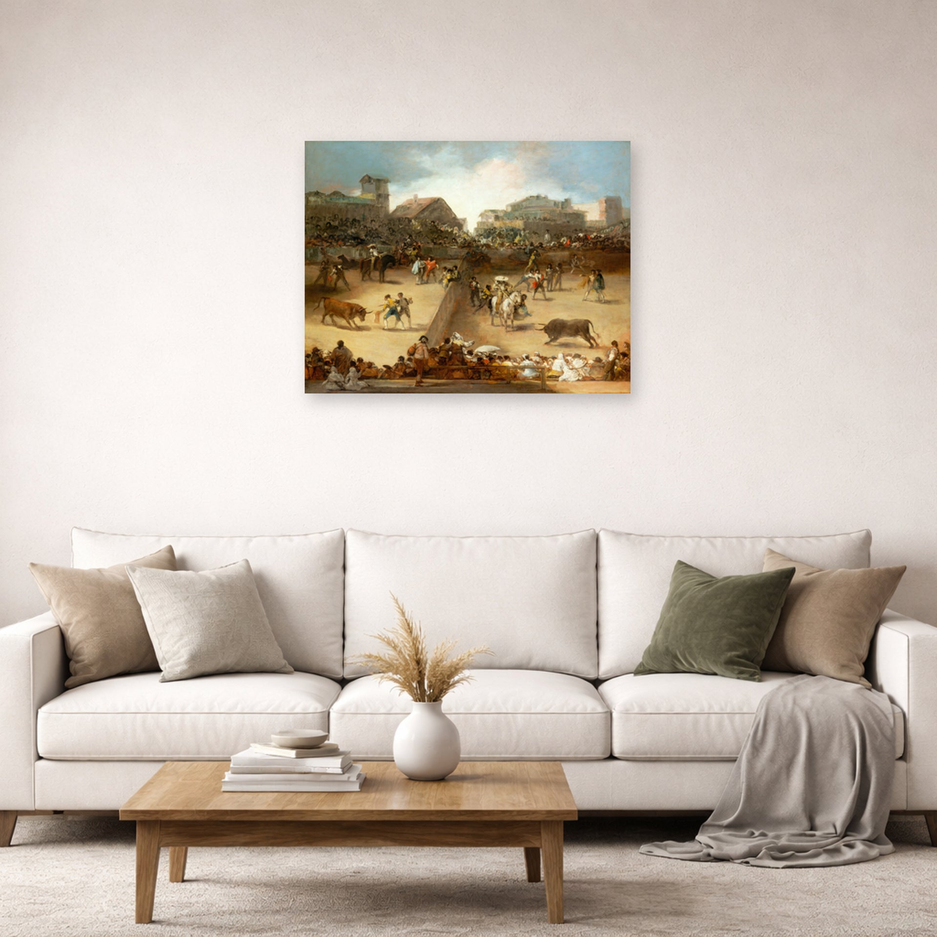 Unframed poster print of Francisco Goya's Bullfight in a Divided Ring displayed on a wall in a second living room setting