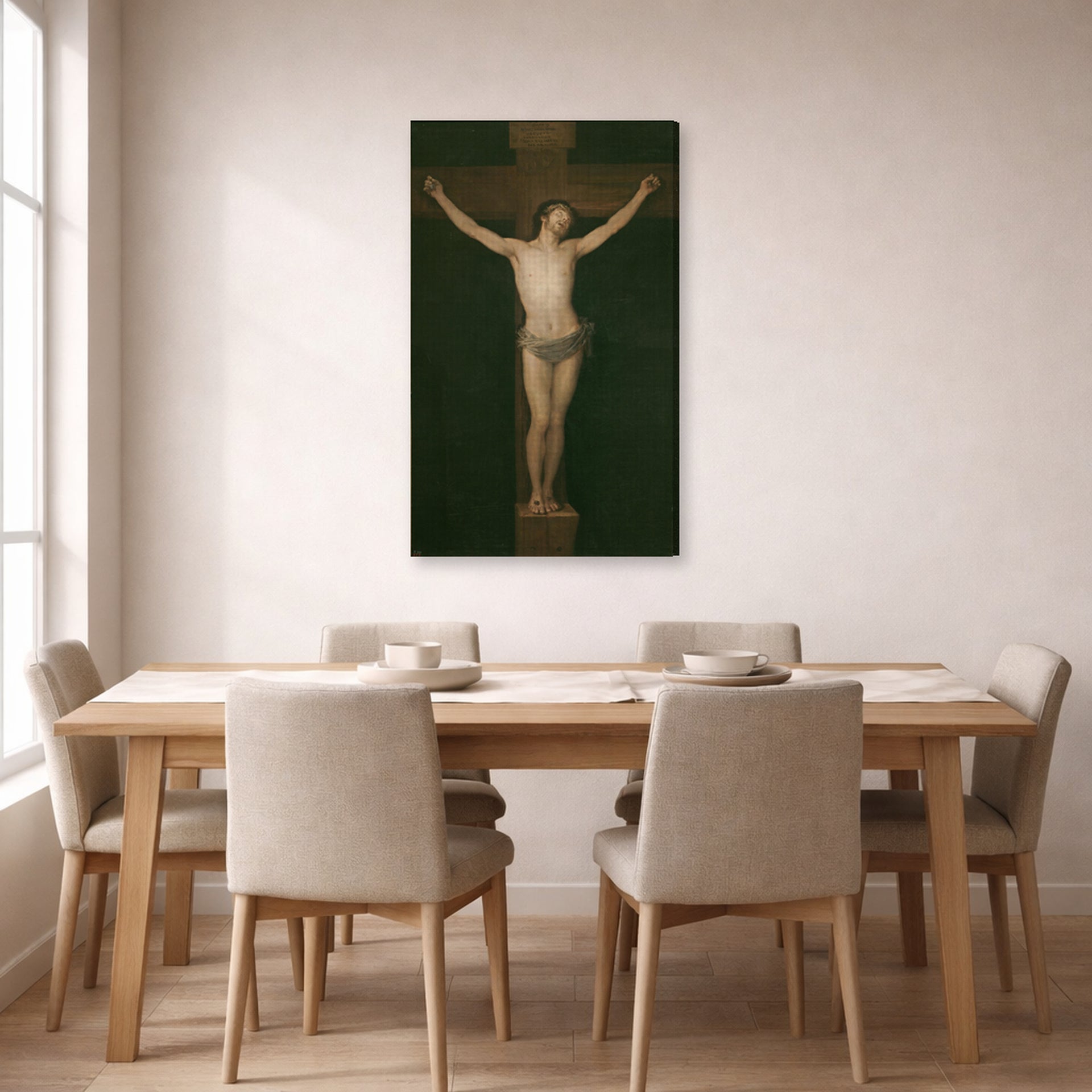 Gallery-wrapped canvas print of Francisco Goya's Christ Crucified displayed on a wall in a dining room
