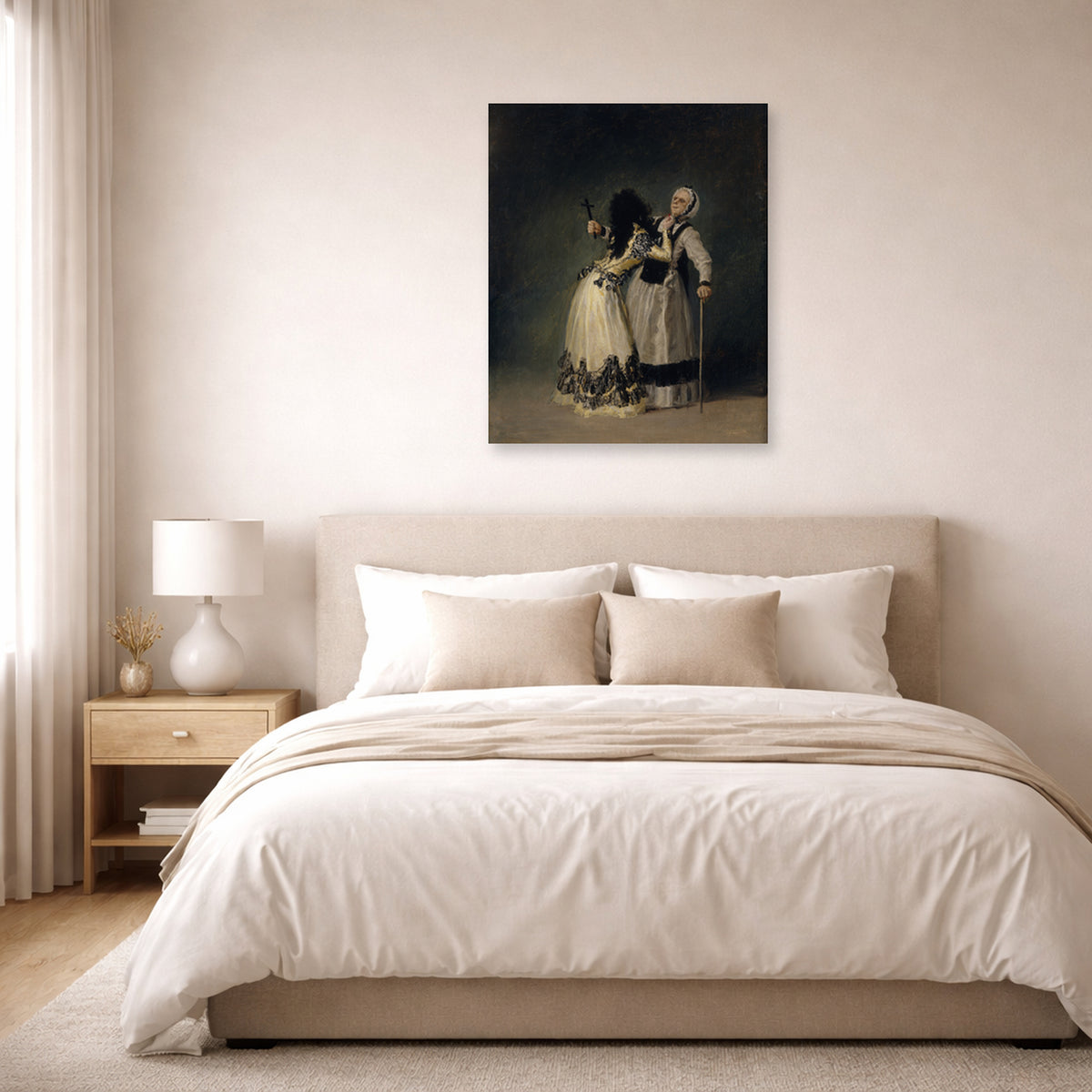 Unframed poster print of Francisco Goya's Duchess of Alba and la Beata displayed on a wall in a bedroom