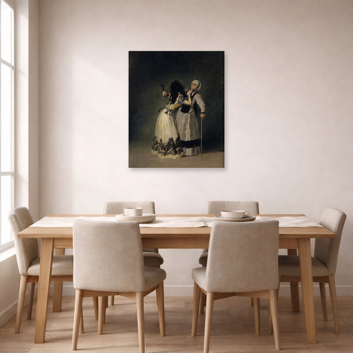 Unframed poster print of Francisco Goya's Duchess of Alba and la Beata displayed on a wall in a dining room
