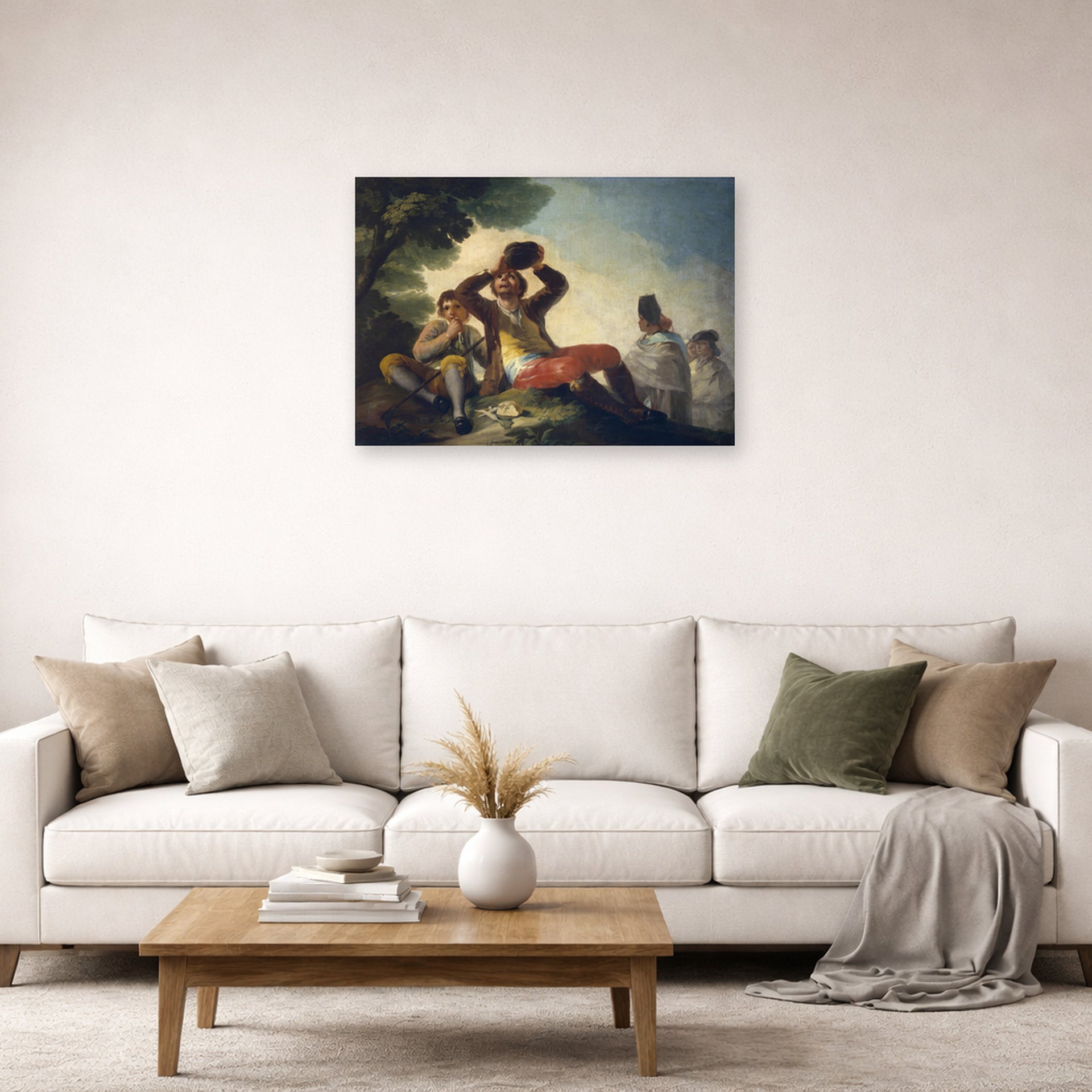 Unframed poster print of Francisco Goya's El Bebedor displayed on a wall in a second living room setting