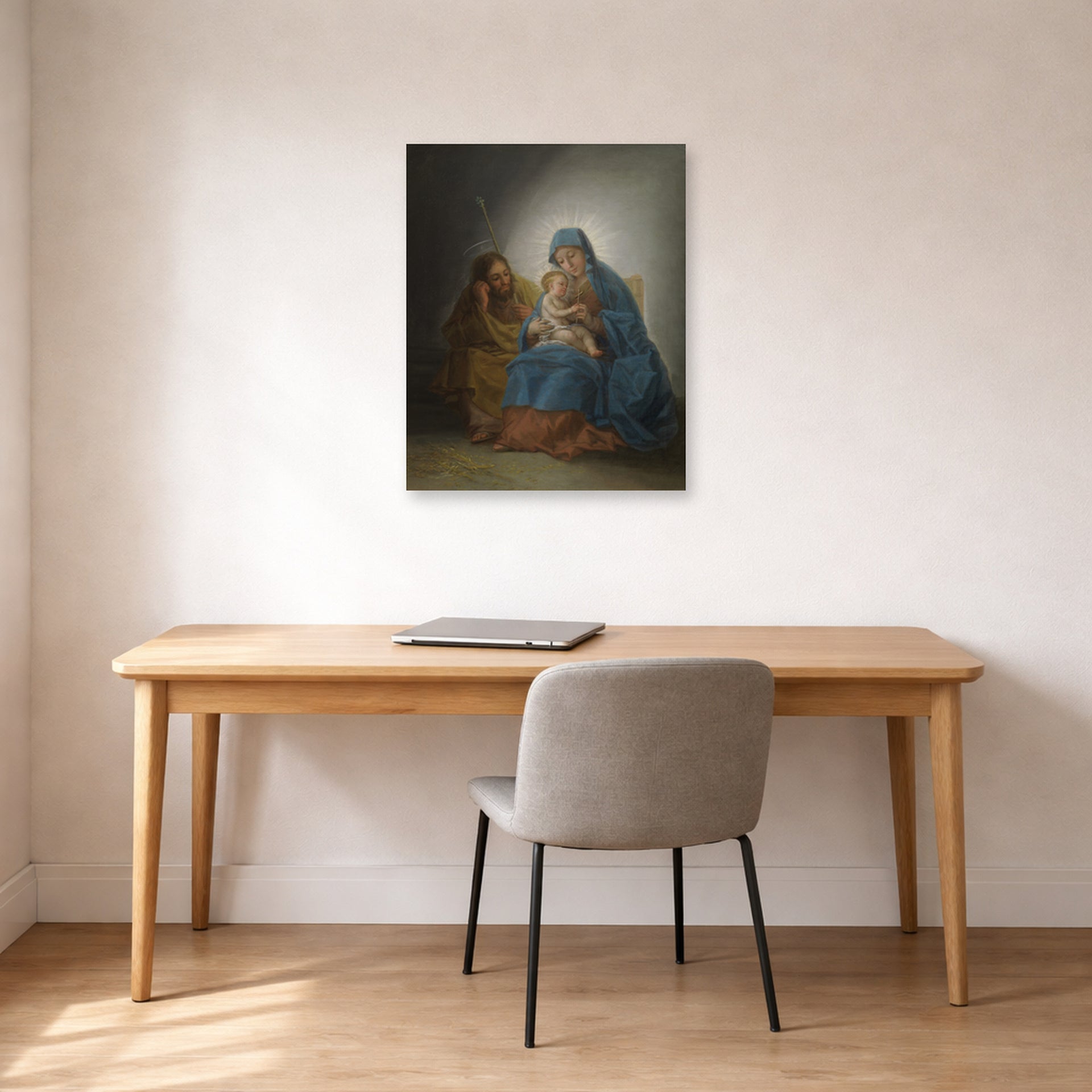 Unframed poster print of Francisco Goya's La Sagrada Familia displayed on a wall in a office