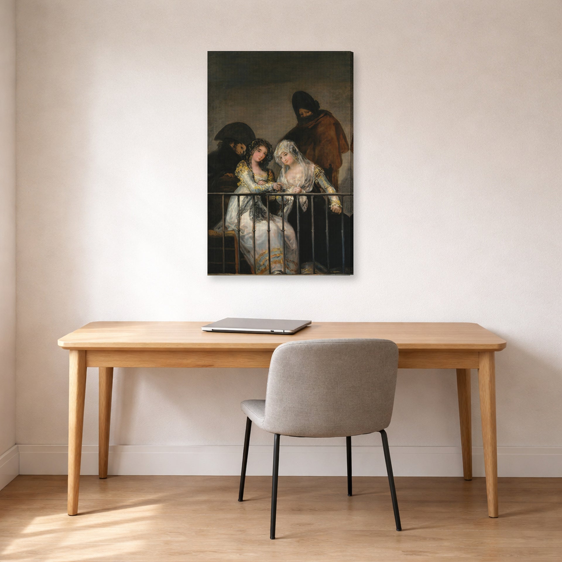 Gallery-wrapped canvas print of Francisco Goya's Majas on a Balcony displayed on a wall in a office