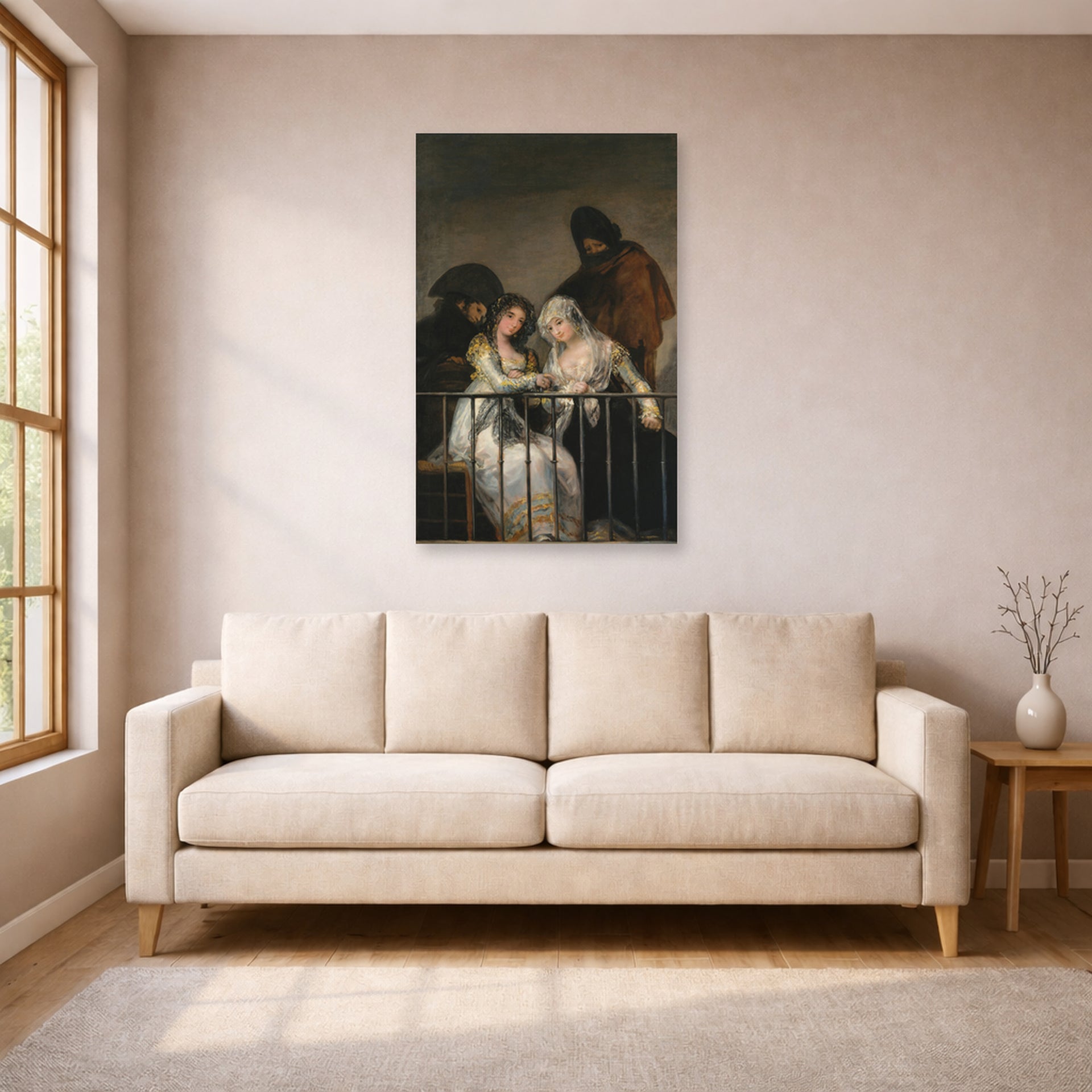 Unframed poster print of Francisco Goya's Majas on a Balcony displayed on a wall in a living room