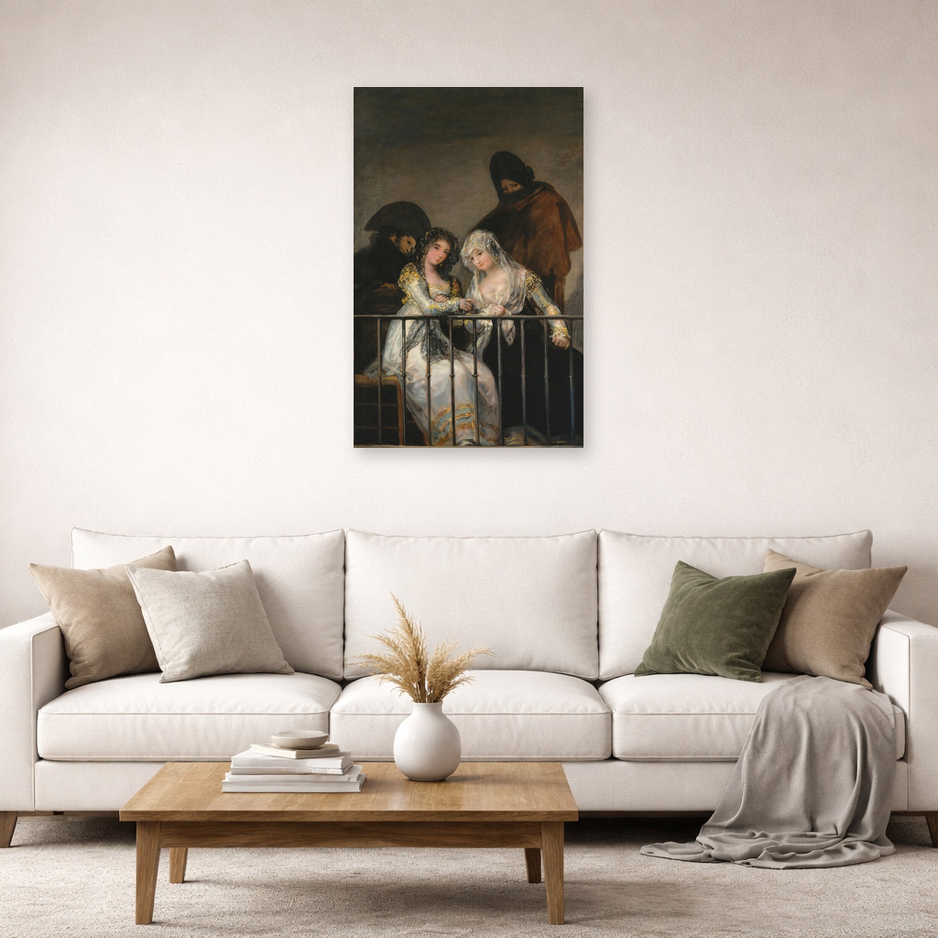 Unframed poster print of Francisco Goya's Majas on a Balcony displayed on a wall in a second living room setting