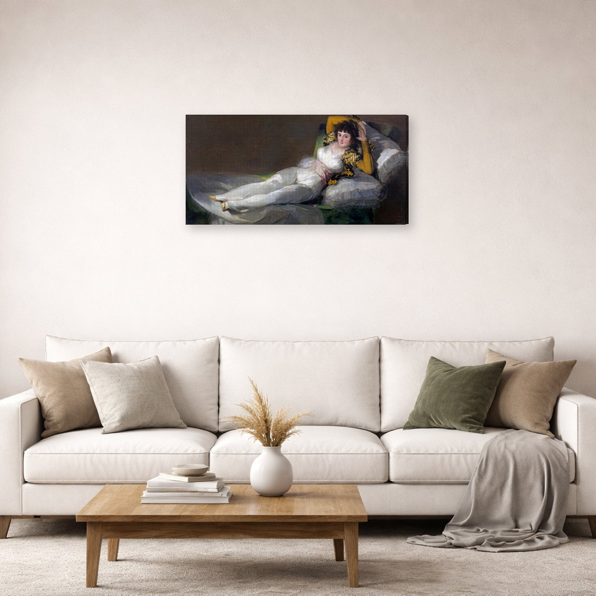 Gallery-wrapped canvas print of Francisco Goya's The Clothed Maja (La maja vestida) displayed on a wall in a second living room setting