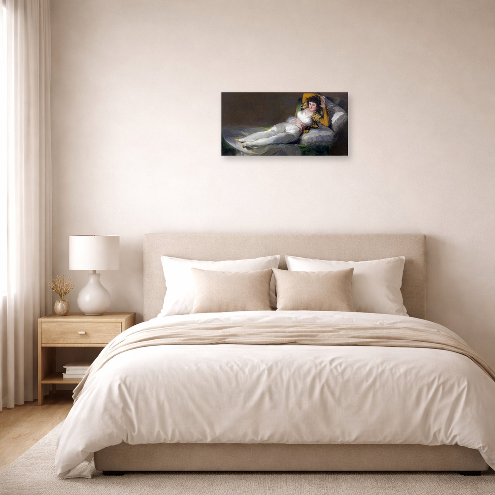 Unframed poster print of Francisco Goya's The Clothed Maja (La maja vestida) displayed on a wall in a bedroom