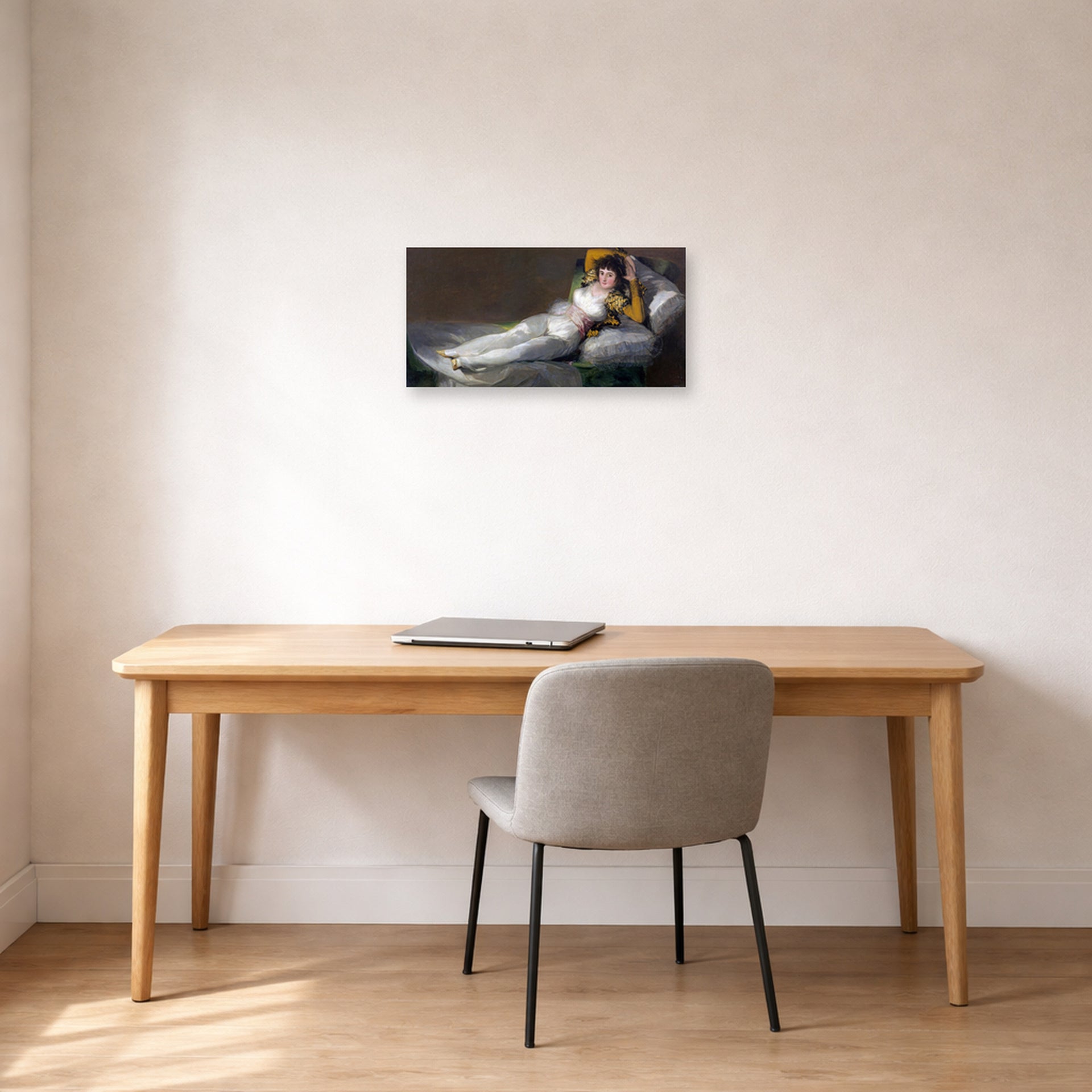 Unframed poster print of Francisco Goya's The Clothed Maja (La maja vestida) displayed on a wall in a office