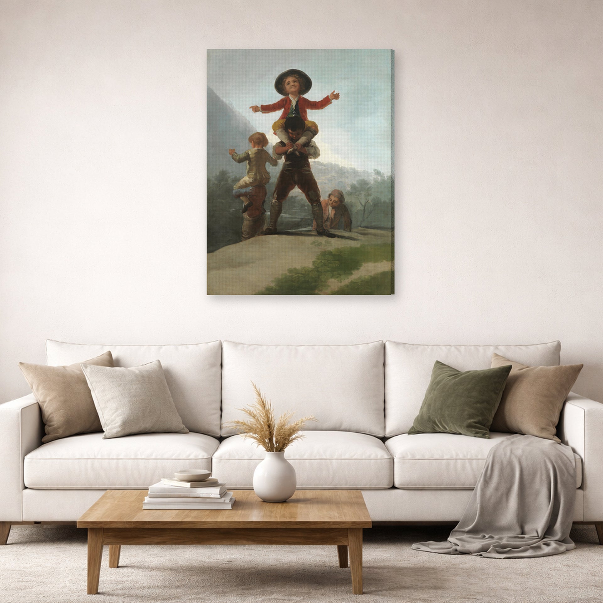 Gallery-wrapped canvas print of Francisco Goya's The Gigantillas displayed on a wall in a second living room setting
