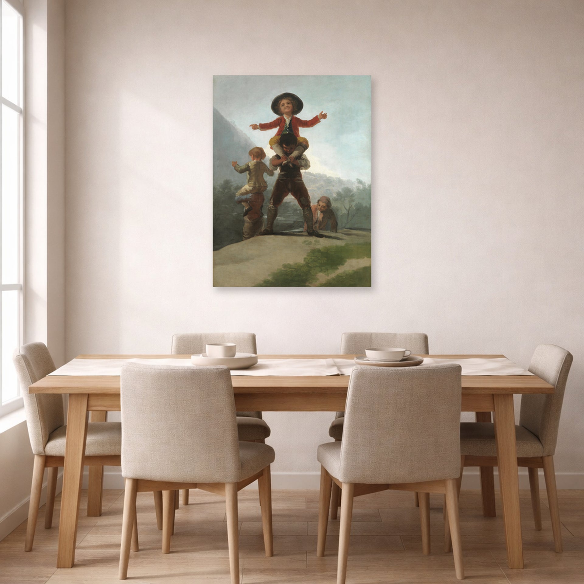 Unframed poster print of Francisco Goya's The Gigantillas displayed on a wall in a dining room