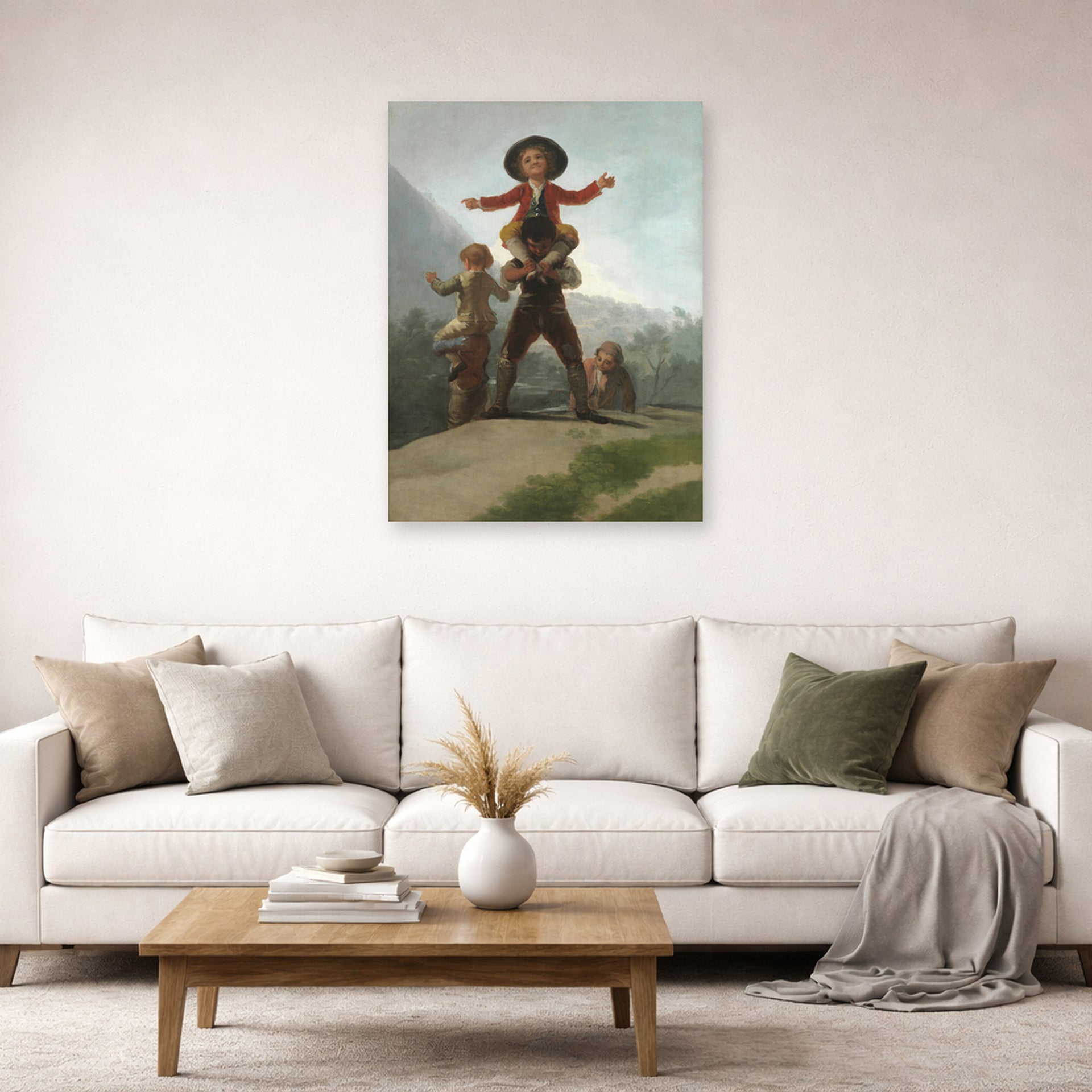 Unframed poster print of Francisco Goya's The Gigantillas displayed on a wall in a second living room setting