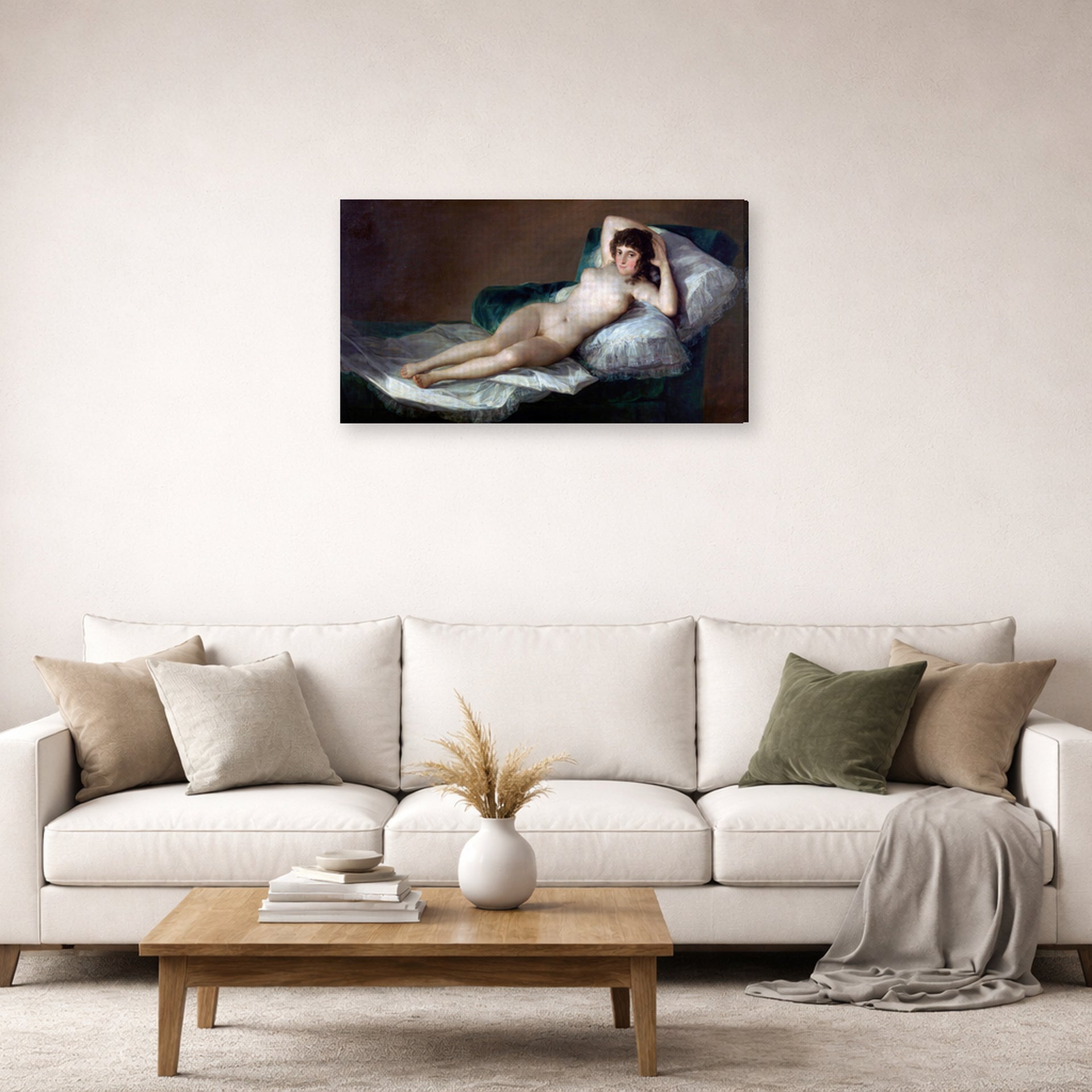 Gallery-wrapped canvas print of Francisco Goya's The Nude Maja (La Maja Desnuda) displayed on a wall in a second living room setting