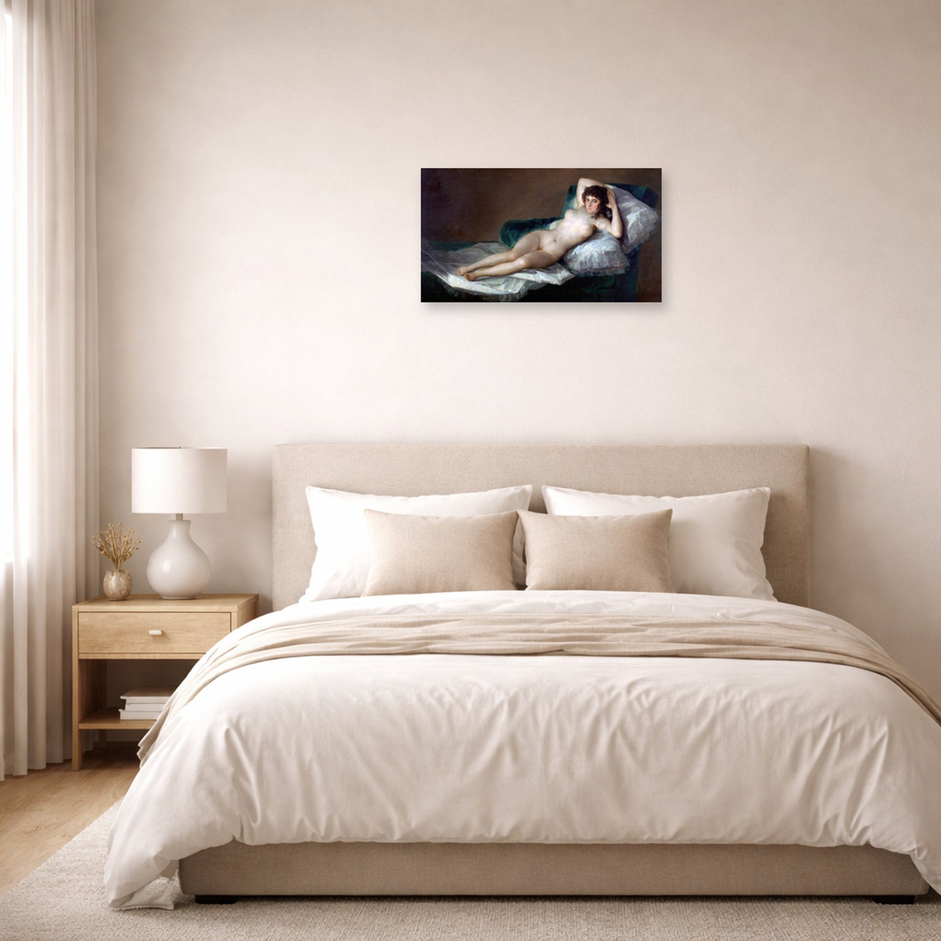 Unframed poster print of Francisco Goya's The Nude Maja (La Maja Desnuda) displayed on a wall in a bedroom