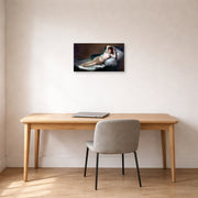 Unframed poster print of Francisco Goya's The Nude Maja (La Maja Desnuda) displayed on a wall in a office