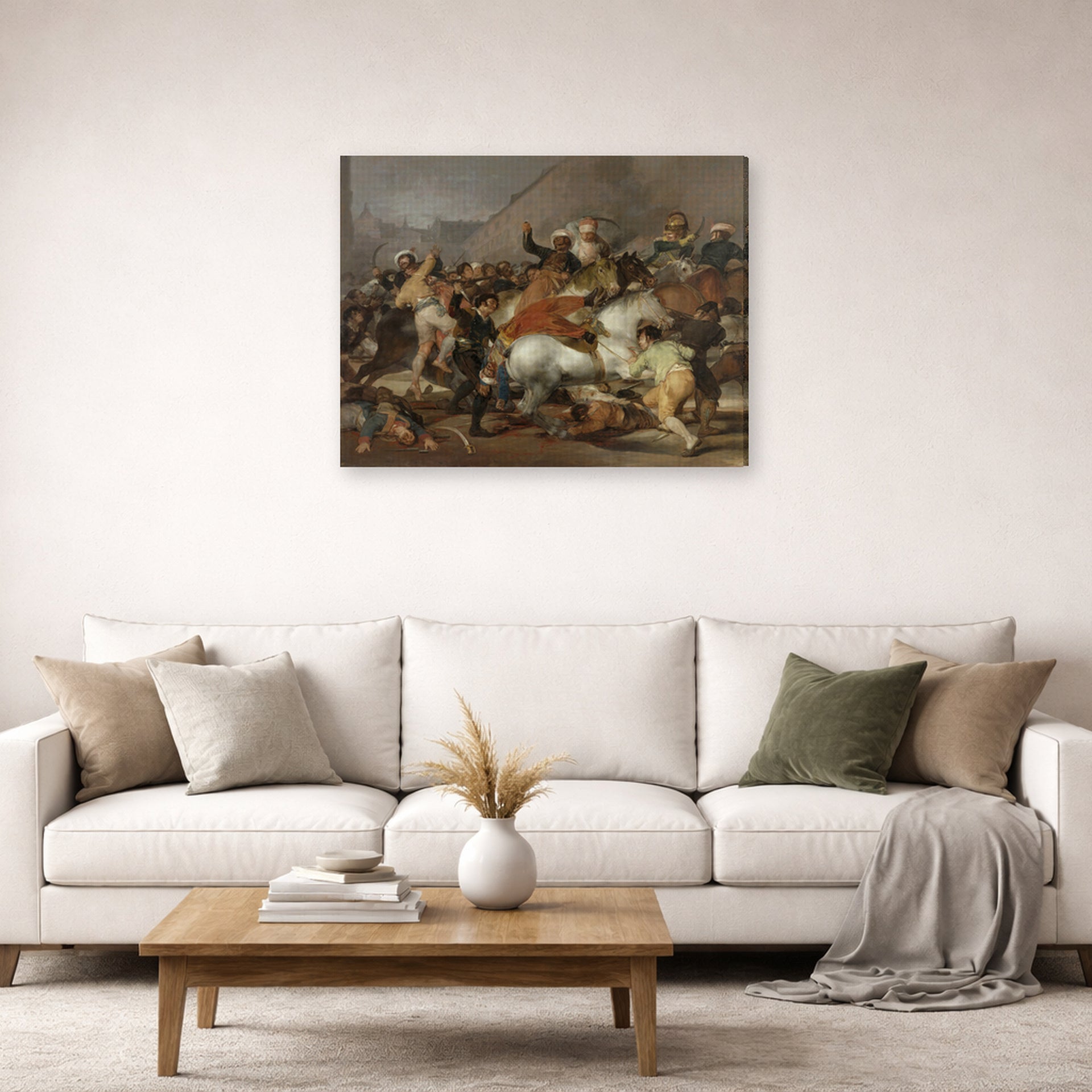 Gallery-wrapped canvas print of Francisco Goya's The Second of May displayed on a wall in a second living room setting