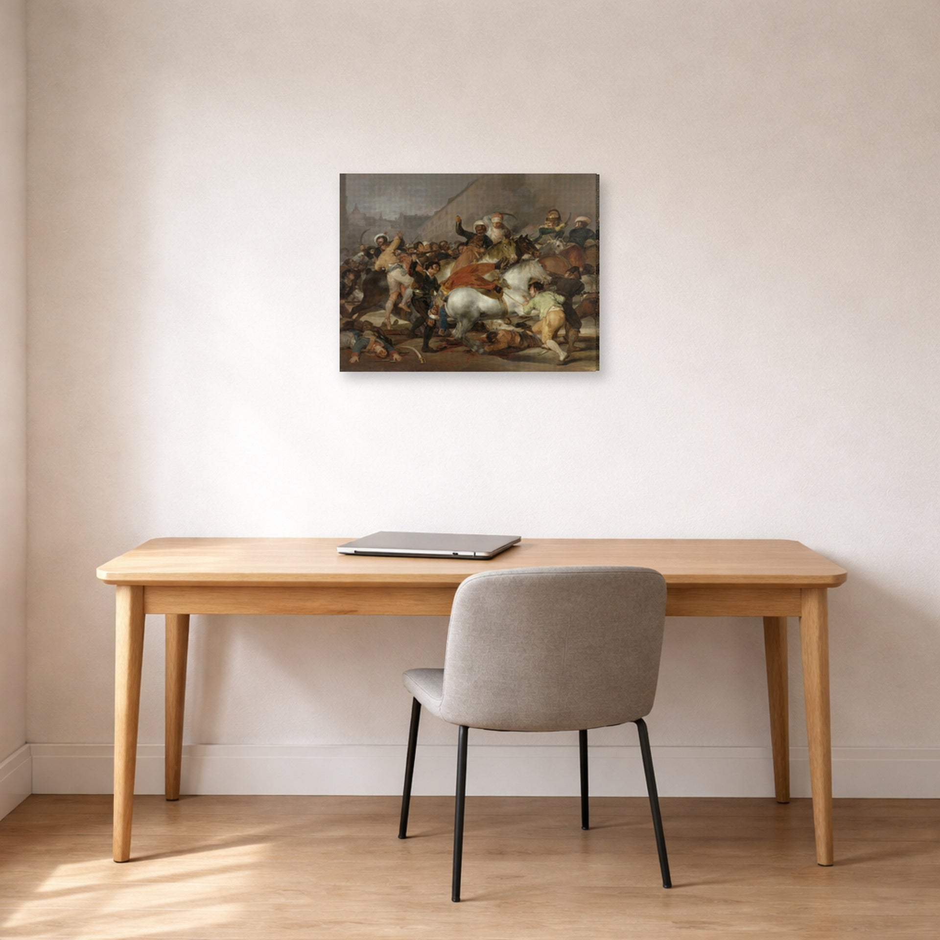 Gallery-wrapped canvas print of Francisco Goya's The Second of May displayed on a wall in a office