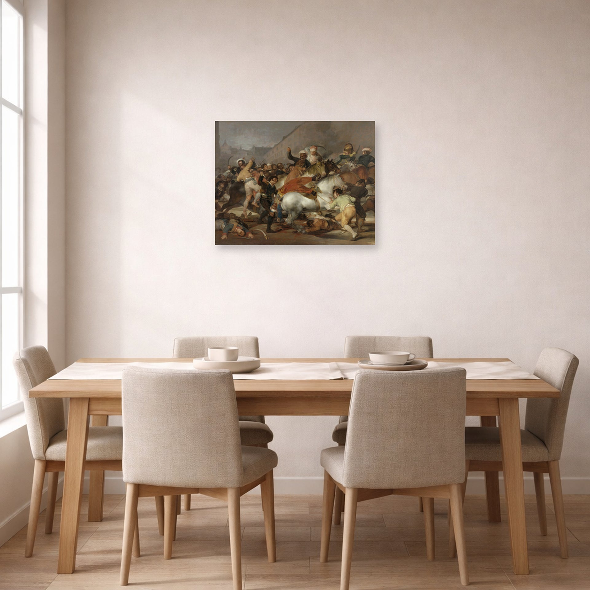 Unframed poster print of Francisco Goya's The Second of May displayed on a wall in a dining room