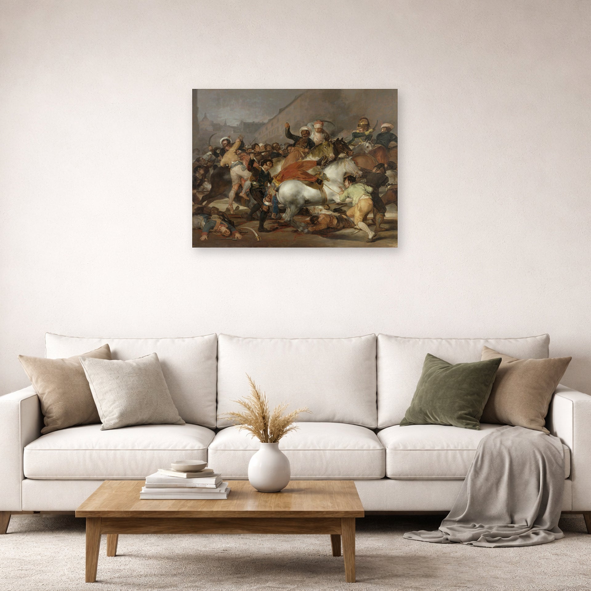 Unframed poster print of Francisco Goya's The Second of May displayed on a wall in a second living room setting