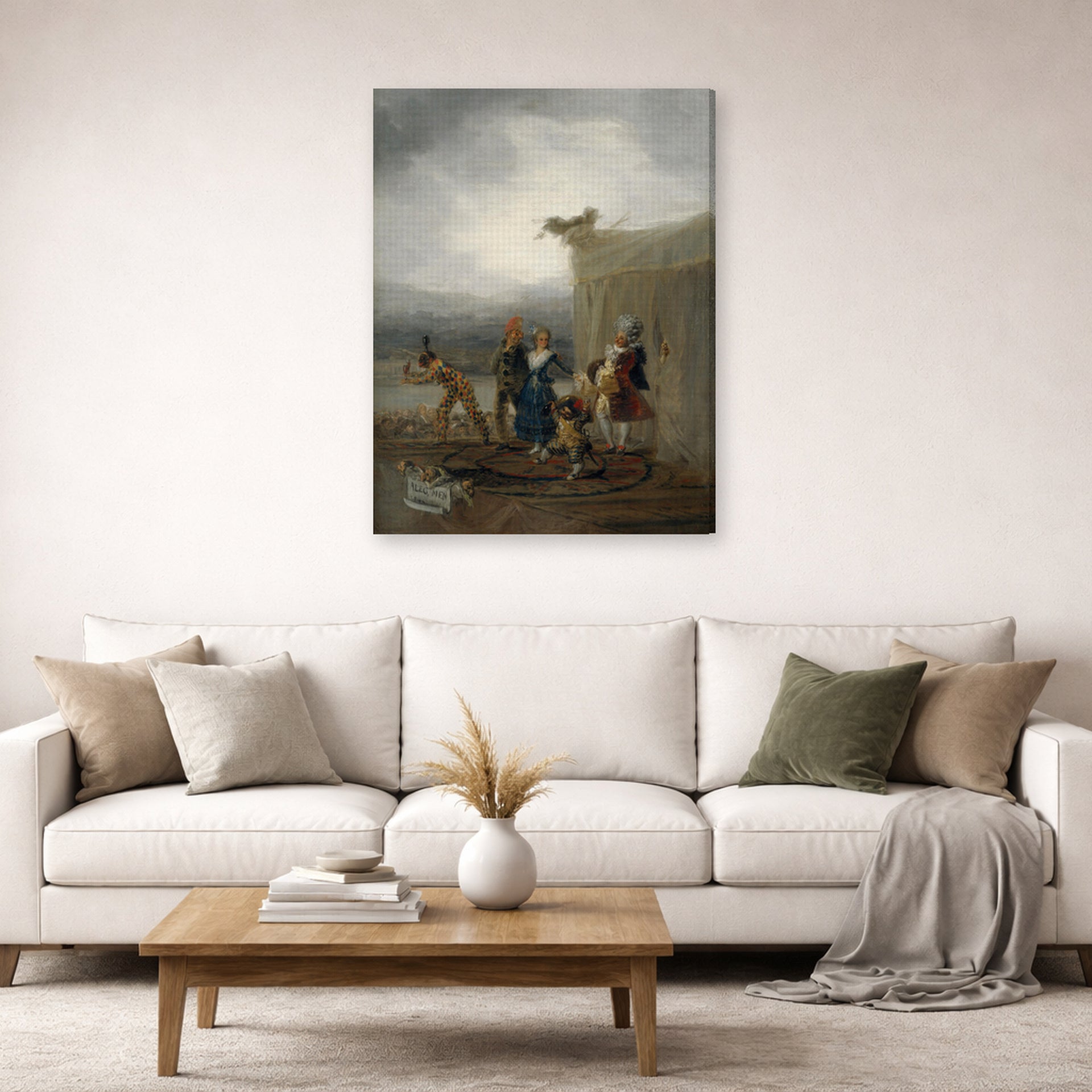 Gallery-wrapped canvas print of Francisco Goya's The Strolling Players displayed on a wall in a second living room setting