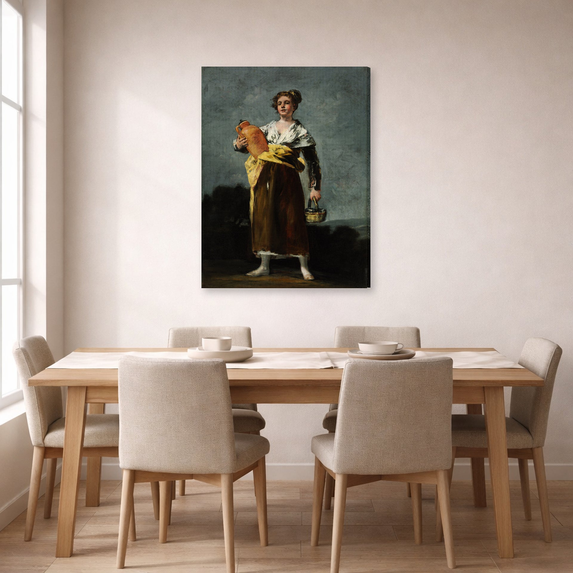 Gallery-wrapped canvas print of Francisco Goya's The Water Carrie displayed on a wall in a dining room