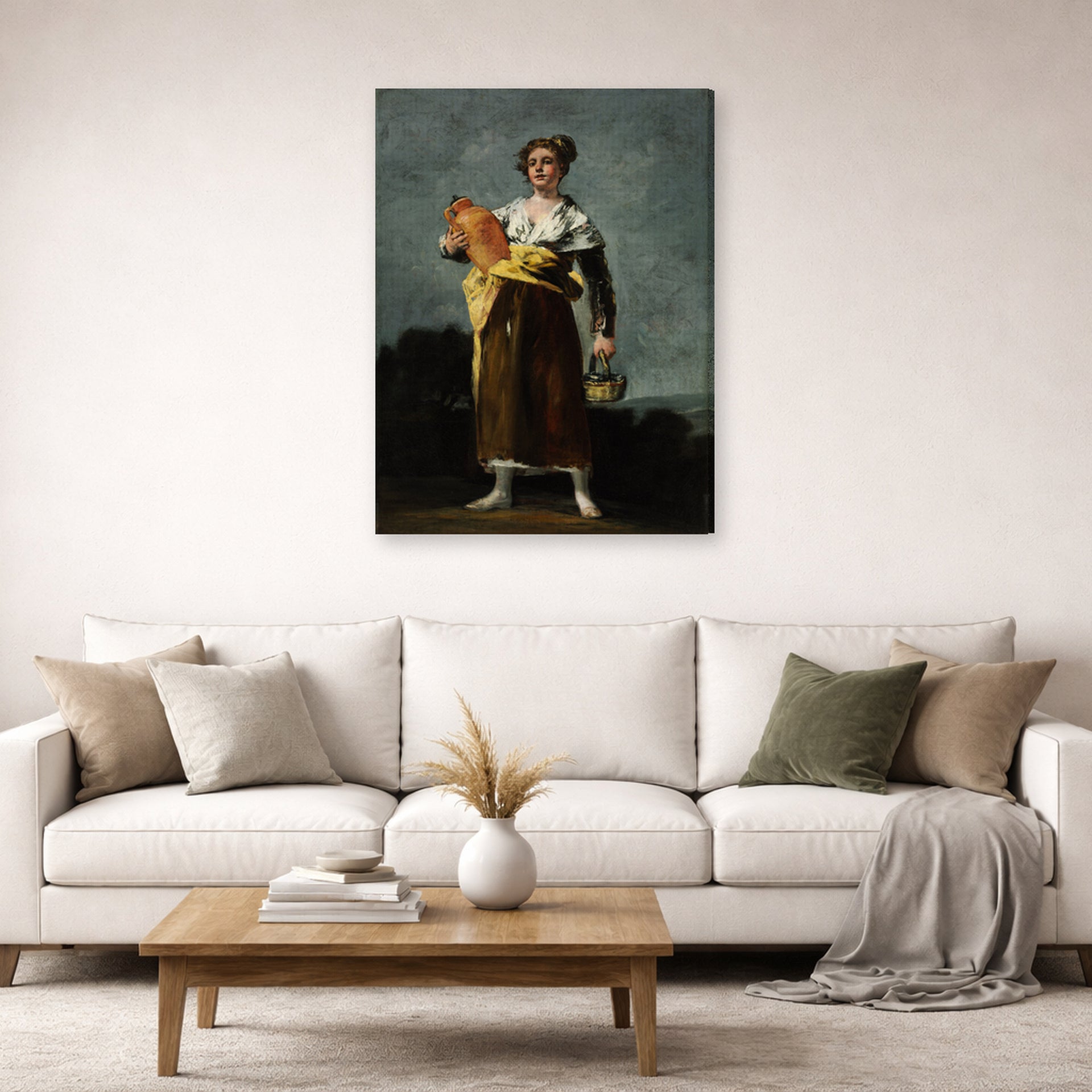 Gallery-wrapped canvas print of Francisco Goya's The Water Carrie displayed on a wall in a second living room setting