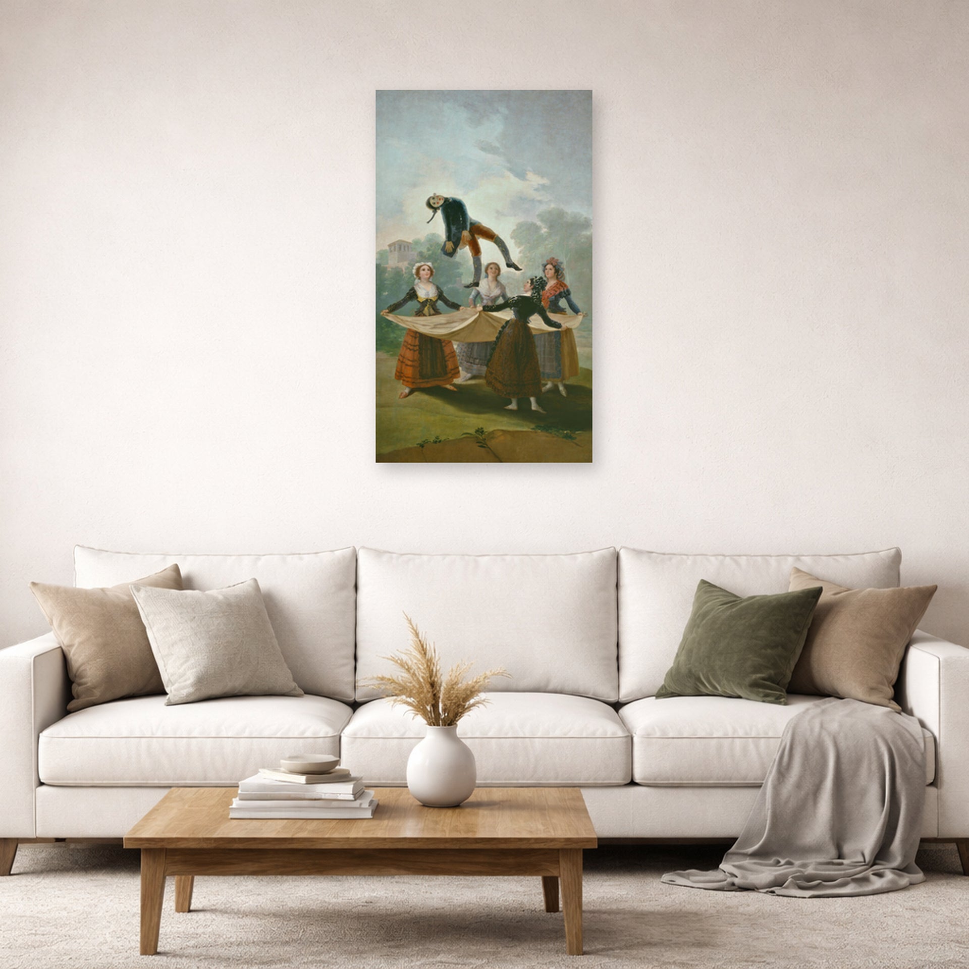 Unframed poster print of Francisco Goya's The Wimp displayed on a wall in a second living room setting