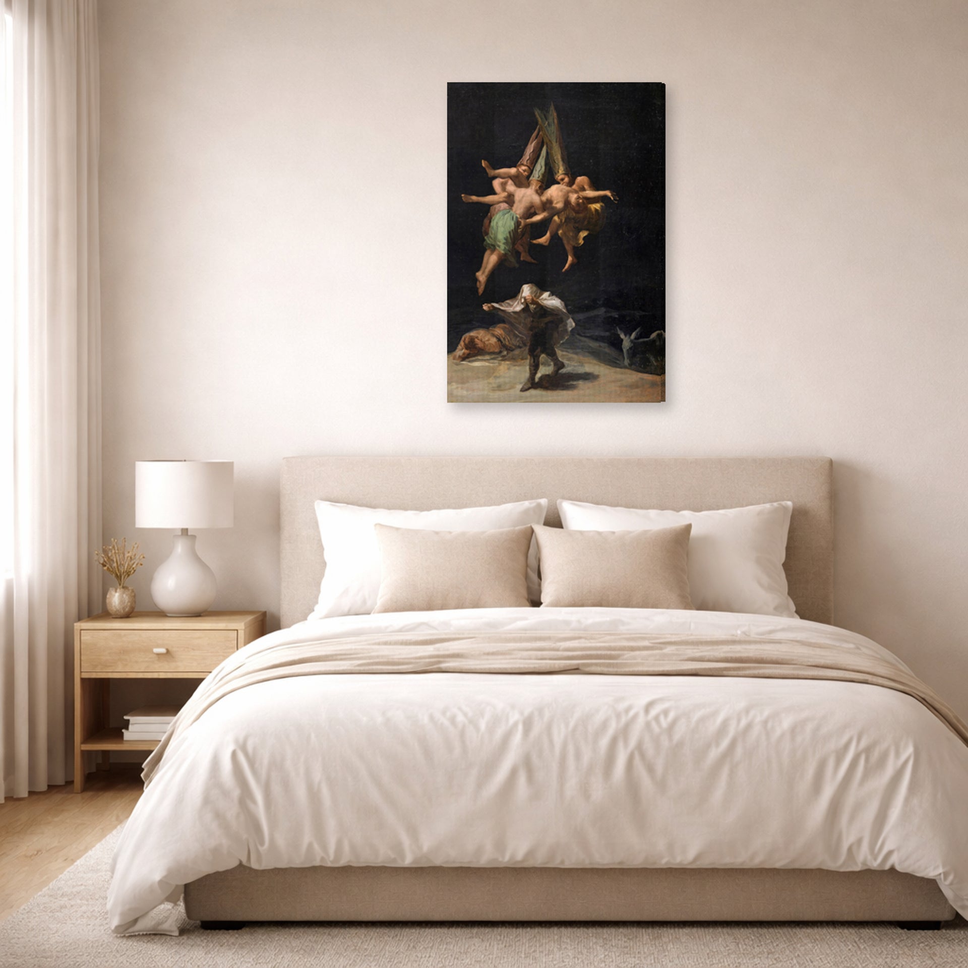 Gallery-wrapped canvas print of Francisco Goya's Witches Flight displayed on a wall in a bedroom