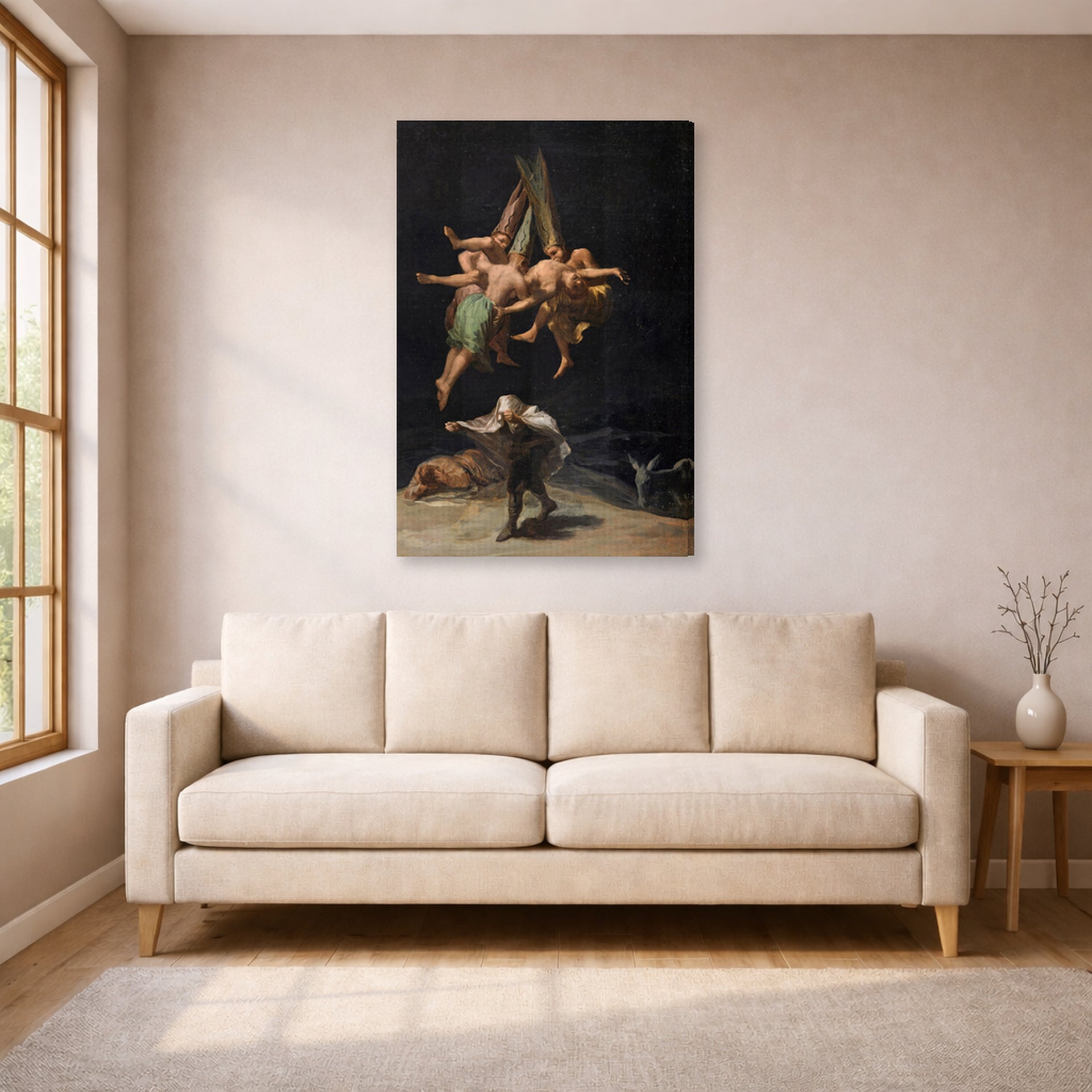 Gallery-wrapped canvas print of Francisco Goya's Witches Flight displayed on a wall in a living room