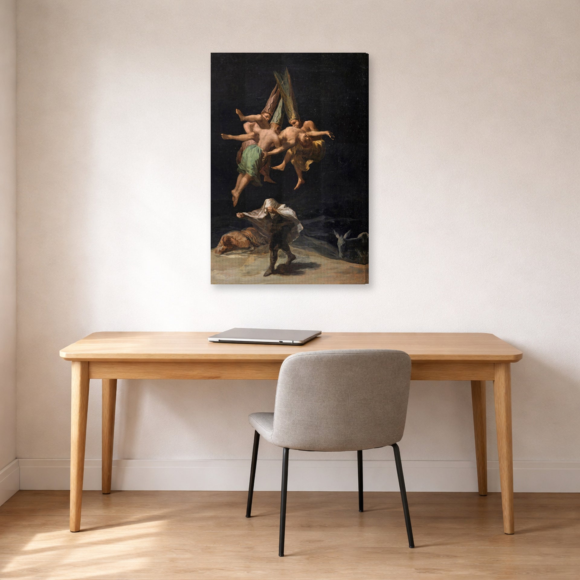 Gallery-wrapped canvas print of Francisco Goya's Witches Flight displayed on a wall in a office