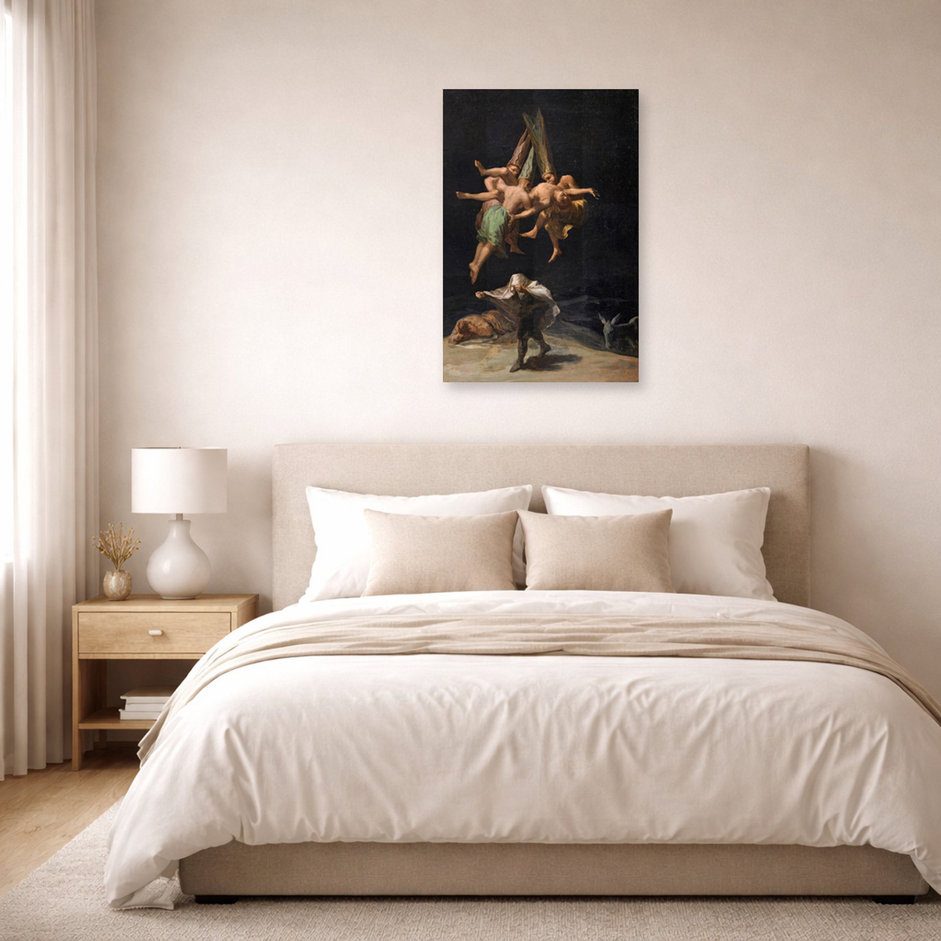 Unframed poster print of Francisco Goya's Witches Flight displayed on a wall in a bedroom