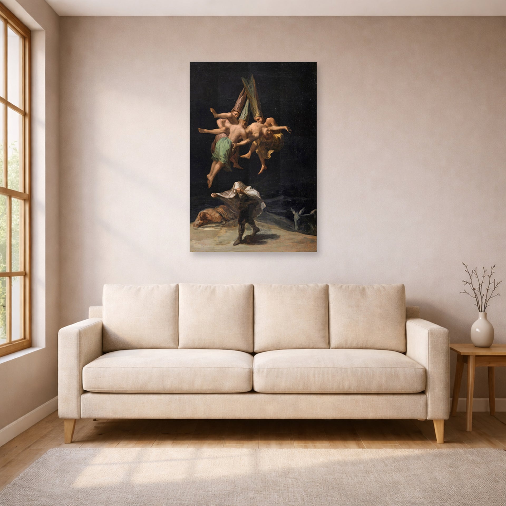 Unframed poster print of Francisco Goya's Witches Flight displayed on a wall in a living room