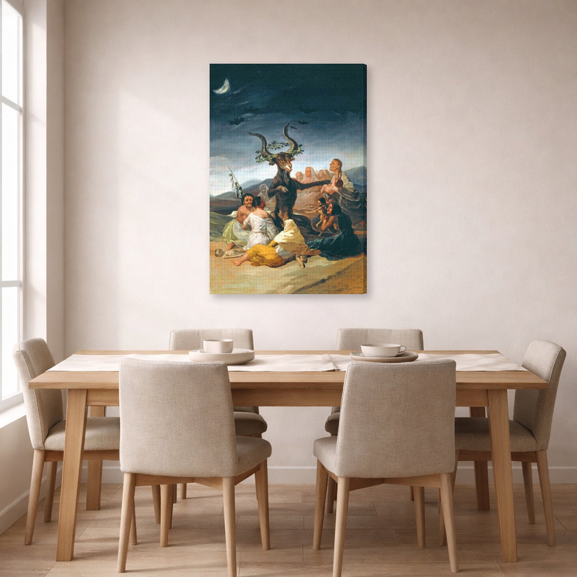 Gallery-wrapped canvas print of Francisco Goya's Witches Sabbath displayed on a wall in a dining room